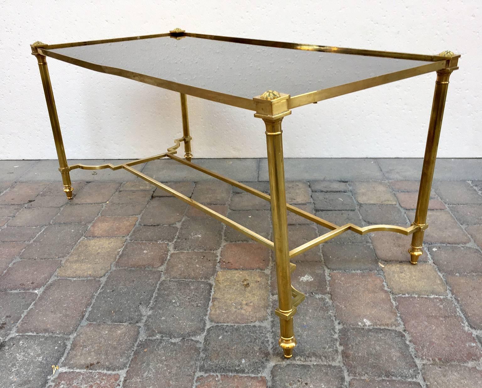 Eegant cocktail table, made in golden laron with black glass top, Maison Jansen style