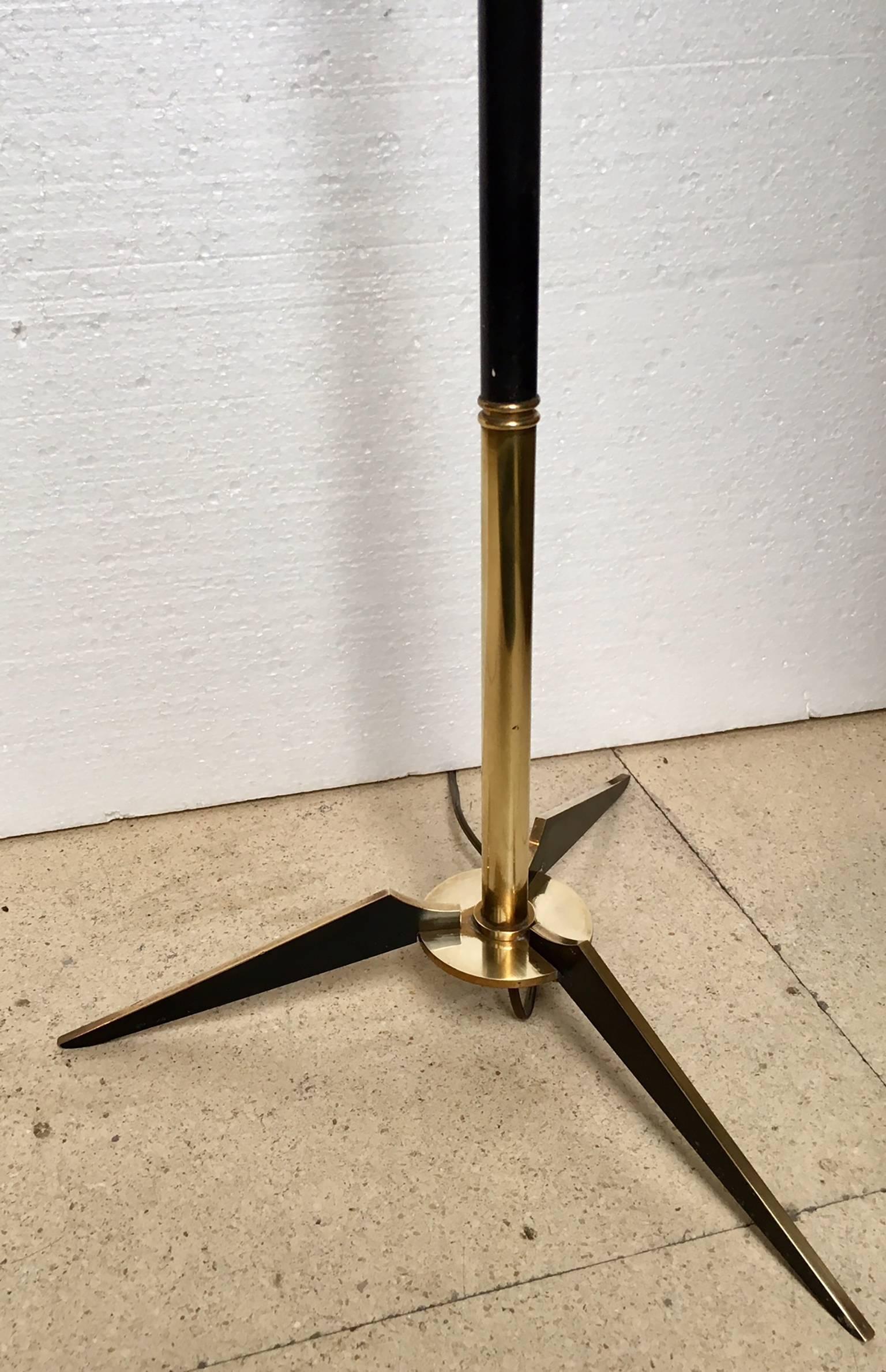 French brass and black lacquered floor lamp, brass and black lacquered tripod base.
No sold with shade.
