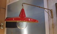 Lumi, an Adjustable Lacquered Aluminum and Brass Wall Light, Italy, 1950