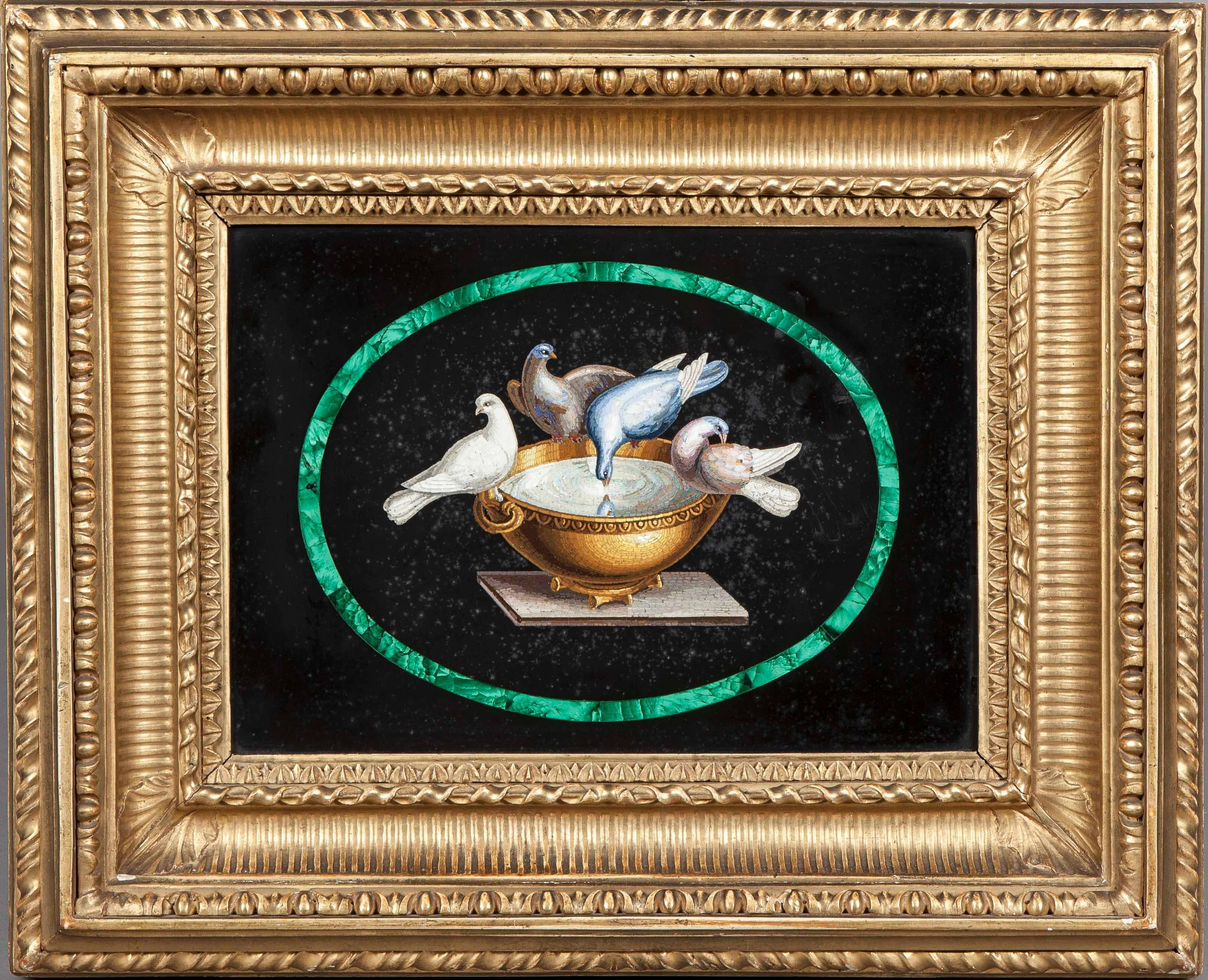 
Of rectangular form, housed within a conforming gilt frame; depicting the ‘Doves of Pliny’ within an elliptical malachite reserve.
Italian, Circa 1860

Bears a retailers label ‘Sumasca, Via del Corso, Rome’ to the reverse.

Dimensions: H: 8