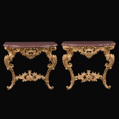 Pair of French 19th Century Carved Giltwood Console Tables with Porphyry Tops