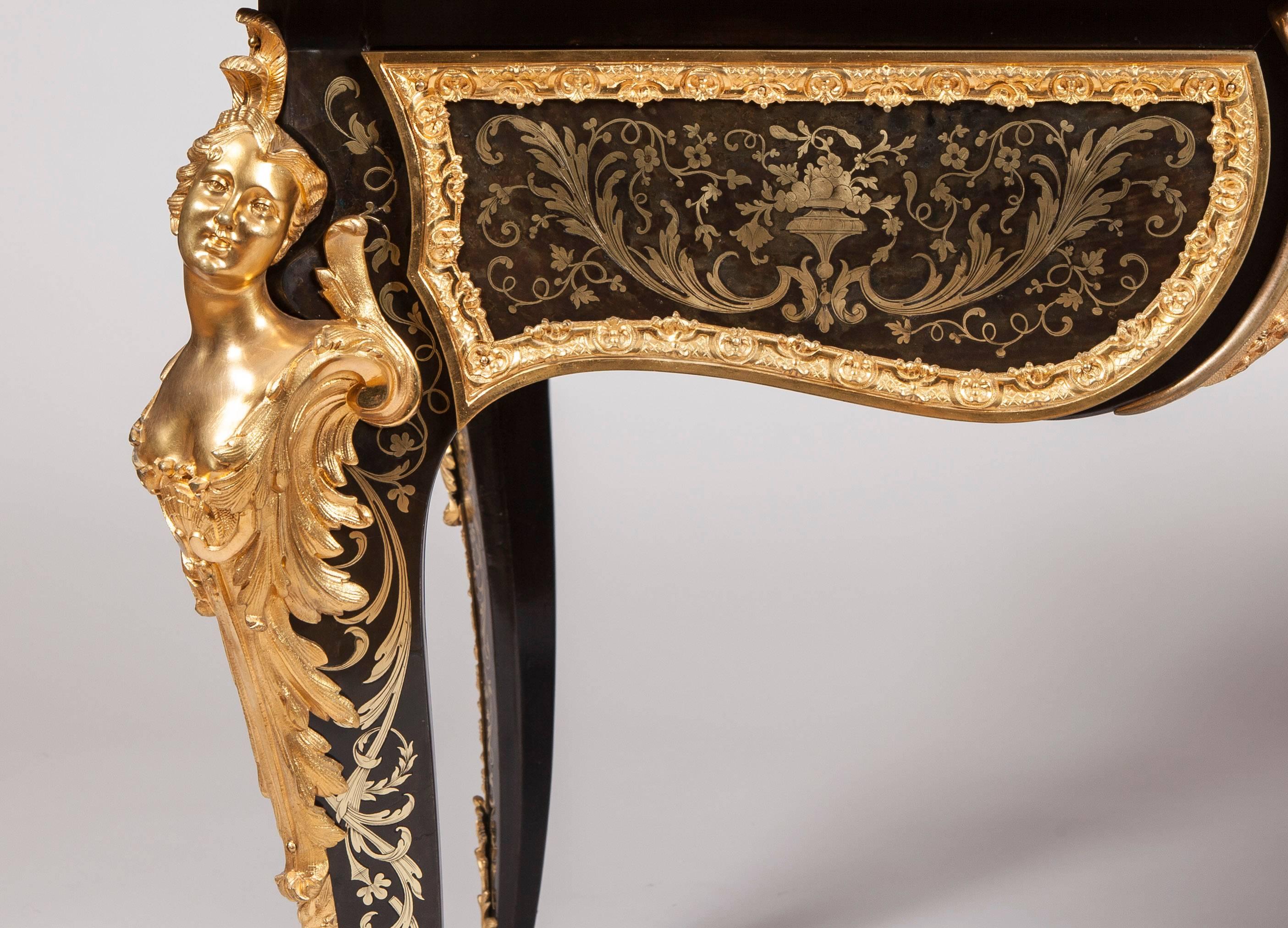 A Fine Bureau Plat in the Manner of André-Charles Boulle

Constructed in ebony with arabesque foliate cut brass inlays, with premiere-partie panels set with tortoiseshell grounds and brass inlay work, and having extensive fine quality ormolu mounts;