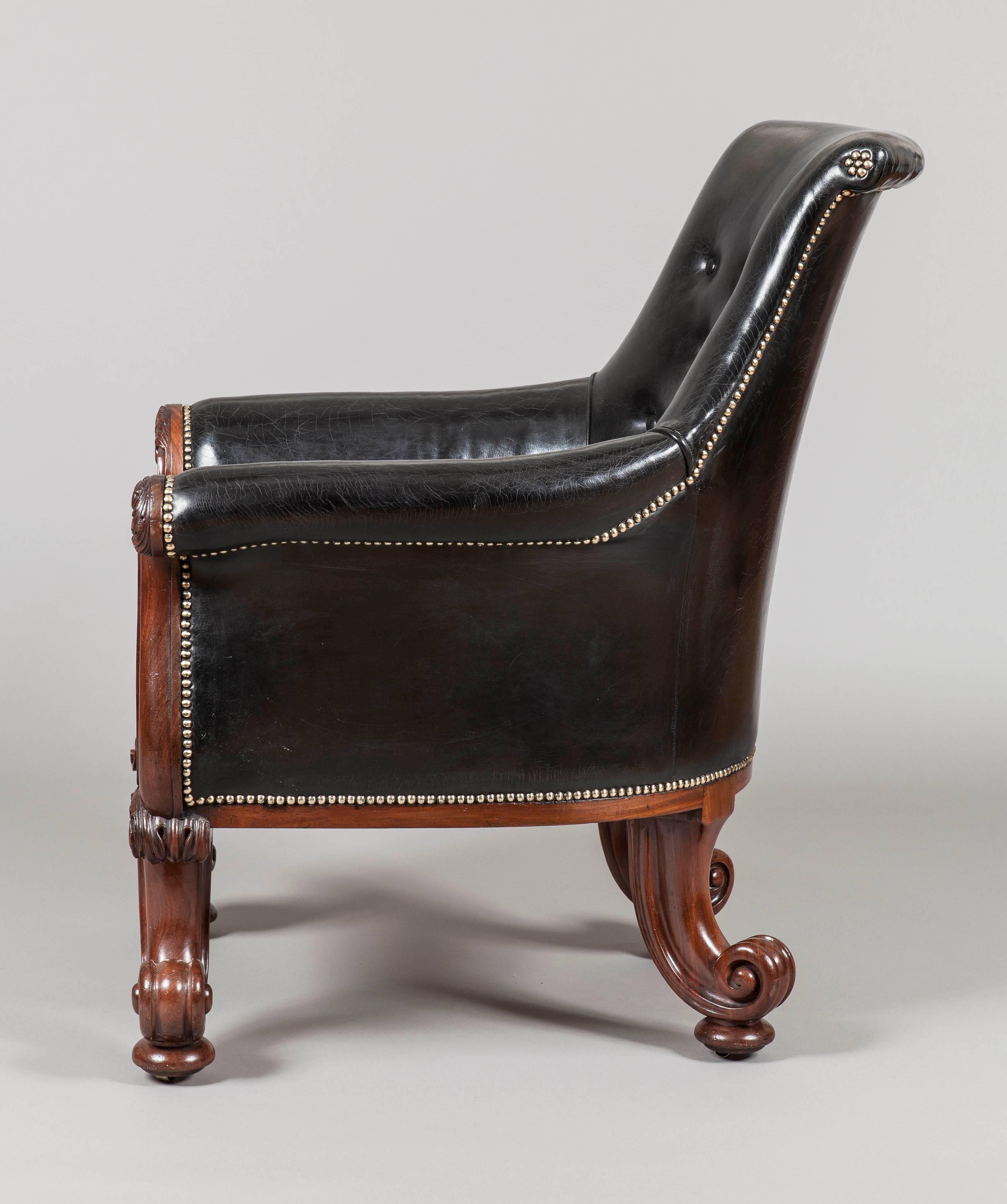 A magnificent pair of George IV library armchairs
firmly attributed to Gillows of London and Lancaster

Constructed in mahogany: the front legs of addorsed 'C' scrolls, confidently and exuberantly carved with foliates, conjoined by a boldy reeded