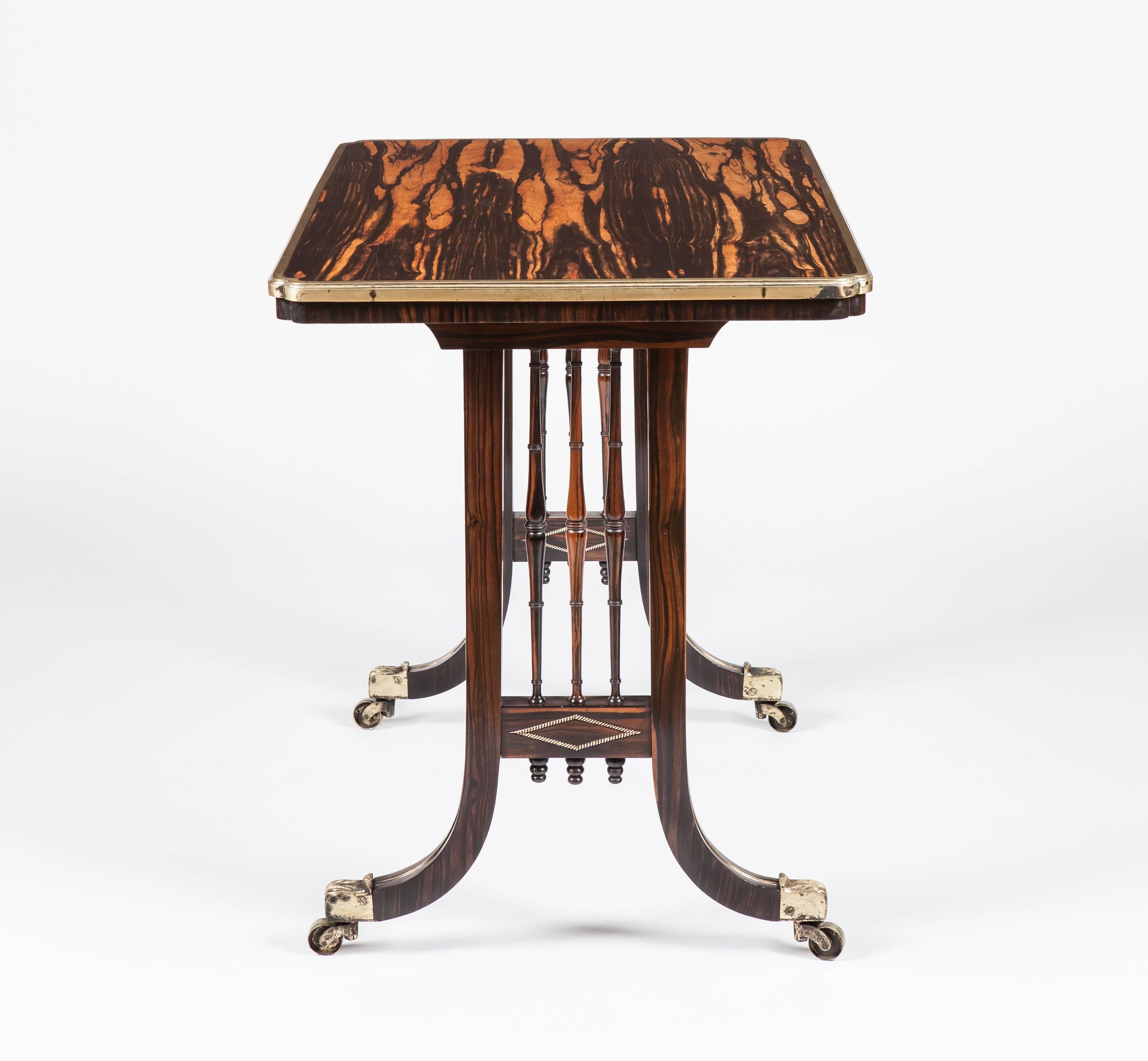 A splendid Regency table firmly attributed to Gillow
with provenance to the Marchioness Dowager of Bath
 
Constructed in a beautifully marked coromandel: rising from bronze caster shod swept reeded legs, the ends housing vertical frames enclosing