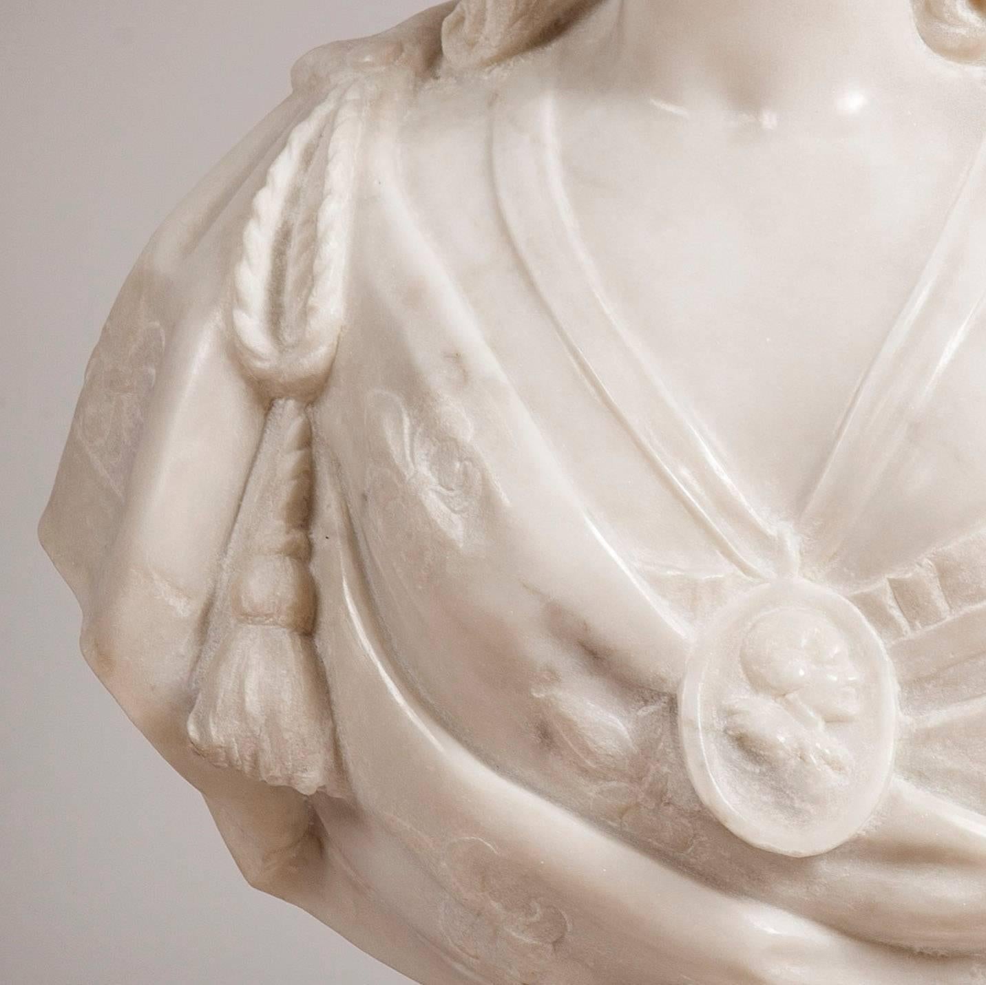 Bust of 'Marie Antoinette' 
After the original by Felix Lecomte
 
Constructed in Carrara statuary marble, the bust of the Queen is set on a truncated fluted column, supported by a square base. She is depicted as proud representing her office as