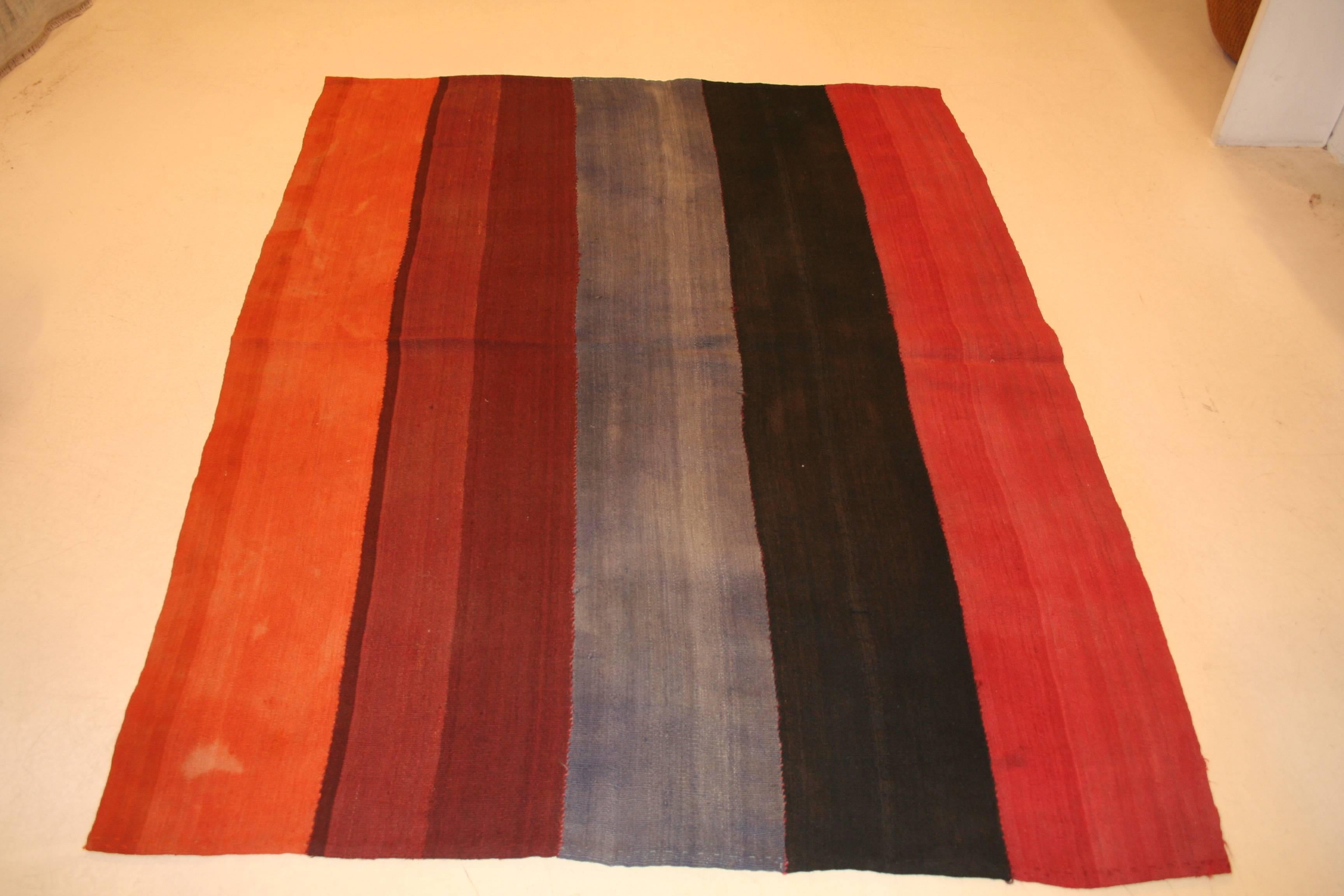 Woven in five vibrant colors, this Turkish wool flat-weave was used by Kurdish nomadic tribes located around the area of Sivas as a tent divider, hanging from the ceiling of the tent creating a partition. Called 'perdeh', which means curtain in