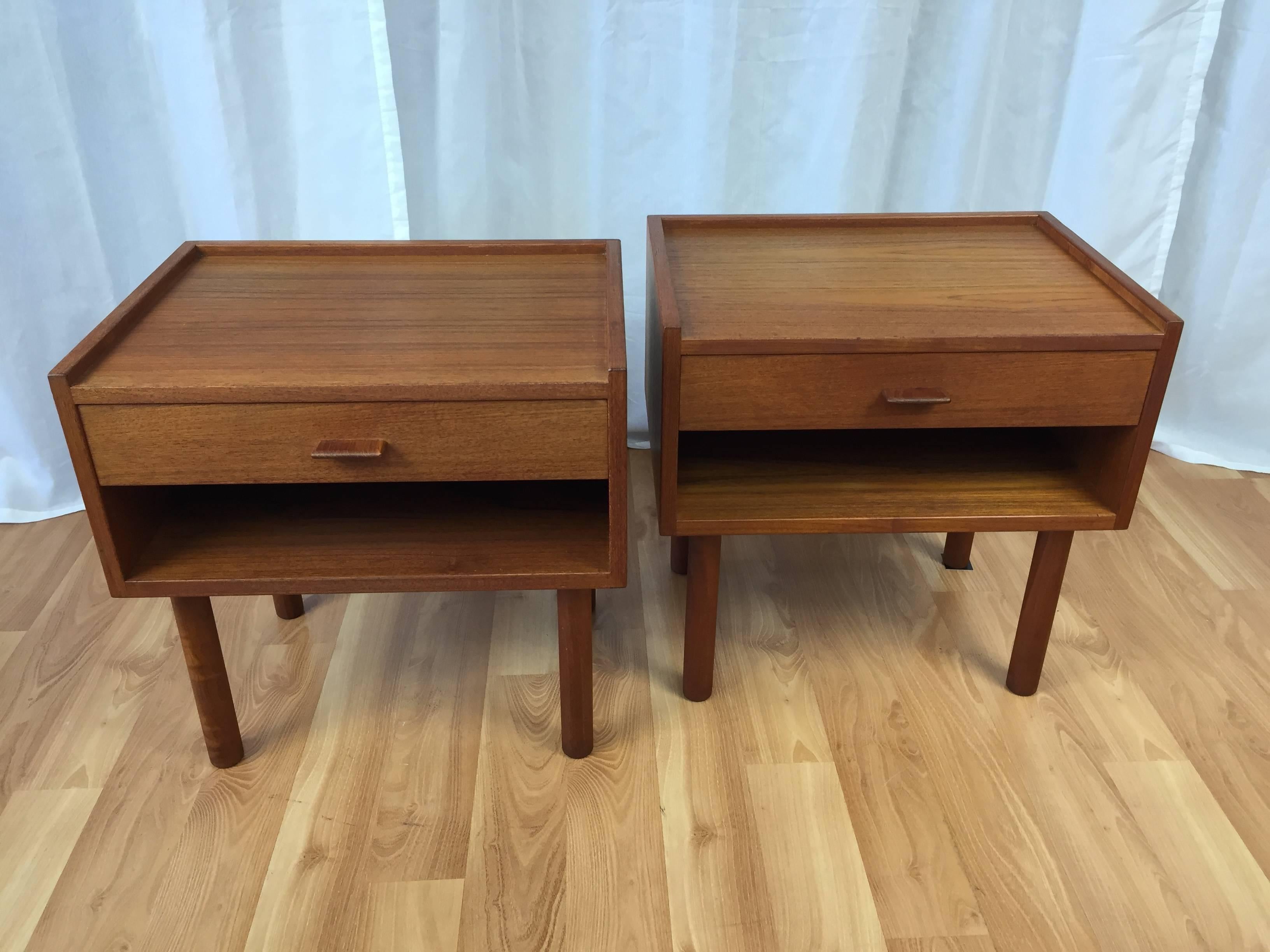 A rare pair of Danish modern teak nightstands (Model RY430) designed by Hans Wegner for Ry Møbler.

Their diminutive scale makes them a perfect fit for smaller spaces, while their strong, clean lines leave a large and lasting impression. Each