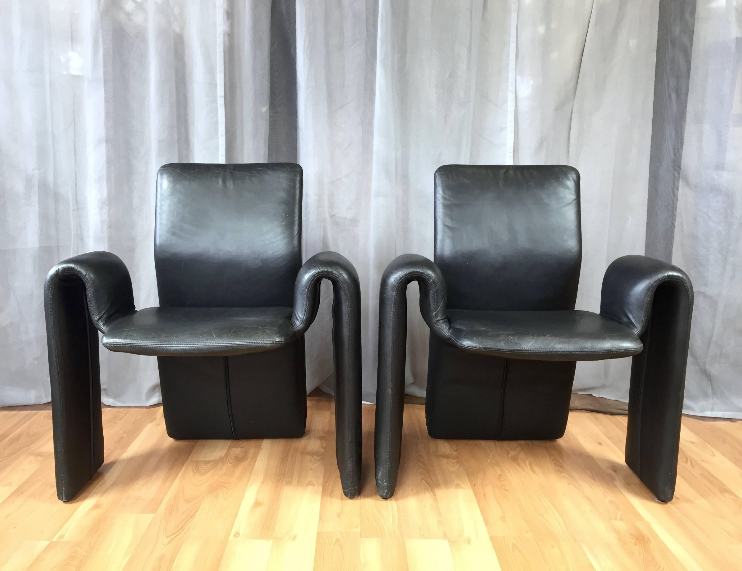 A rare four-piece set of black leather dining chairs by Steve Leonard for Brayton International Collection.

Sinuous shape is evocative of the futuristic designs of Olivier Mourgue or Pierre Paulin. Back has a bit of flex to it, making it a