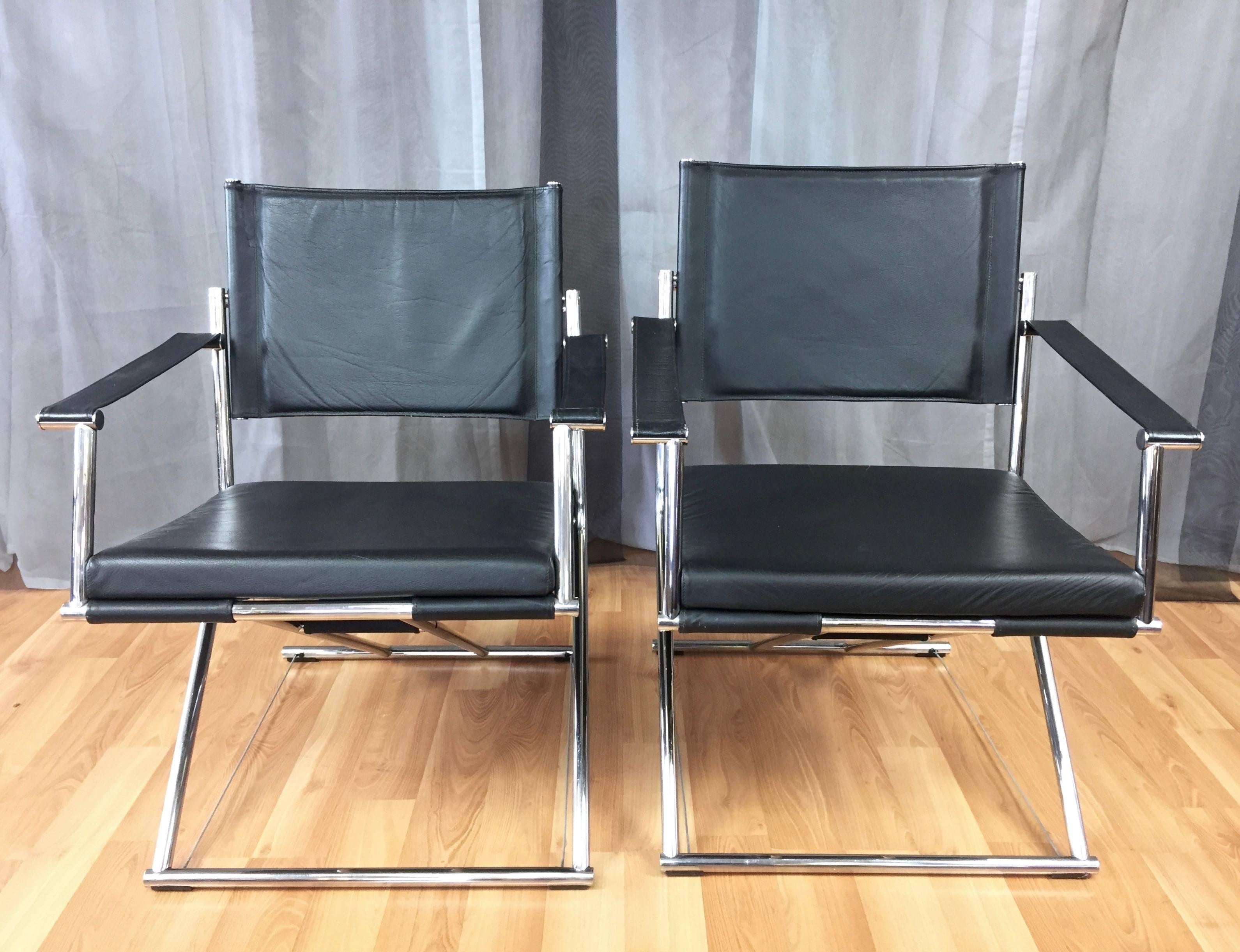 An ingeniously designed pair of modern leather and chrome Eureka folding campaign chairs or gliders by Mark Singer.

The uncommon chair consists of a two-piece tubular chrome frame, soft black leather seats, and flexible steel support cables.