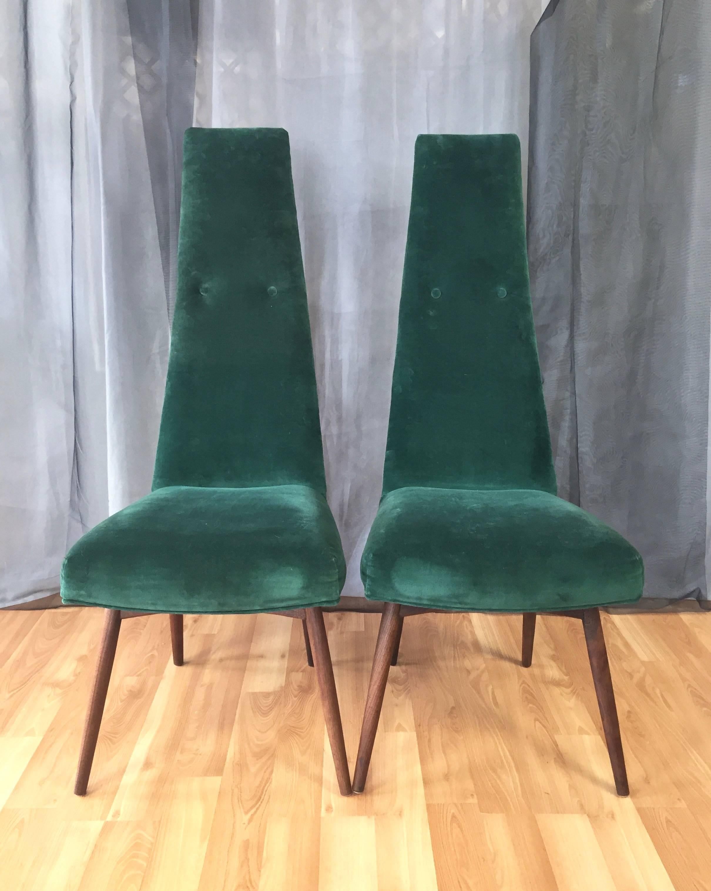 A Mid-Century Modern set of six upholstered walnut dining chairs – four side and two high back by Adrian Pearsall for Craft Associates.

With solid walnut base and supremely comfortable seat upholstered in emerald green velvet. Each is accented by