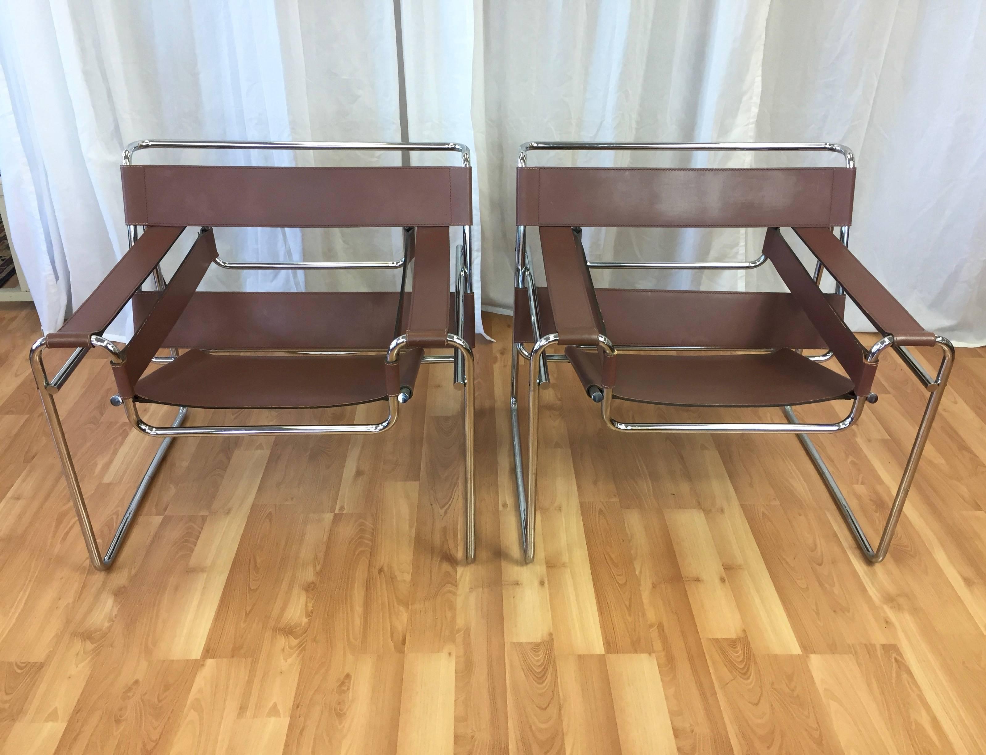 A pair of authentic vintage Model B3 “Wassily” chairs designed by Marcel Breuer and produced by Gavina SpA for Knoll.

An enduring example of Bauhaus luminary Breuer’s revolutionary efforts to reconcile art and industry. Polished seamless tubular