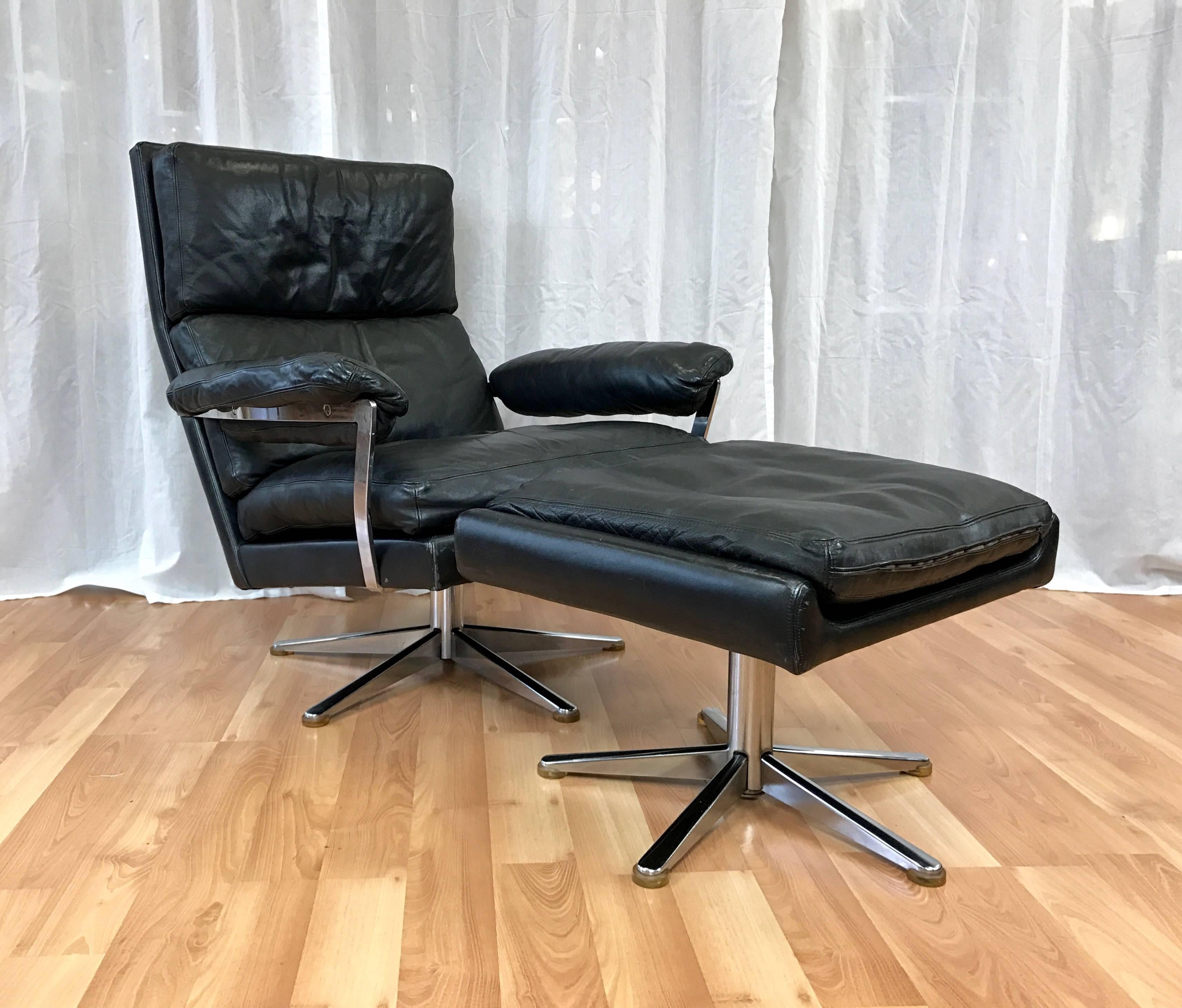 A vintage black leather swiveling lounge chair and ottoman from Sweden.

Clean lines, canted back and generous size make for a very handsome and comfortable chair. Fully upholstered in semi-aniline leather with down and foam padding. Polished flat