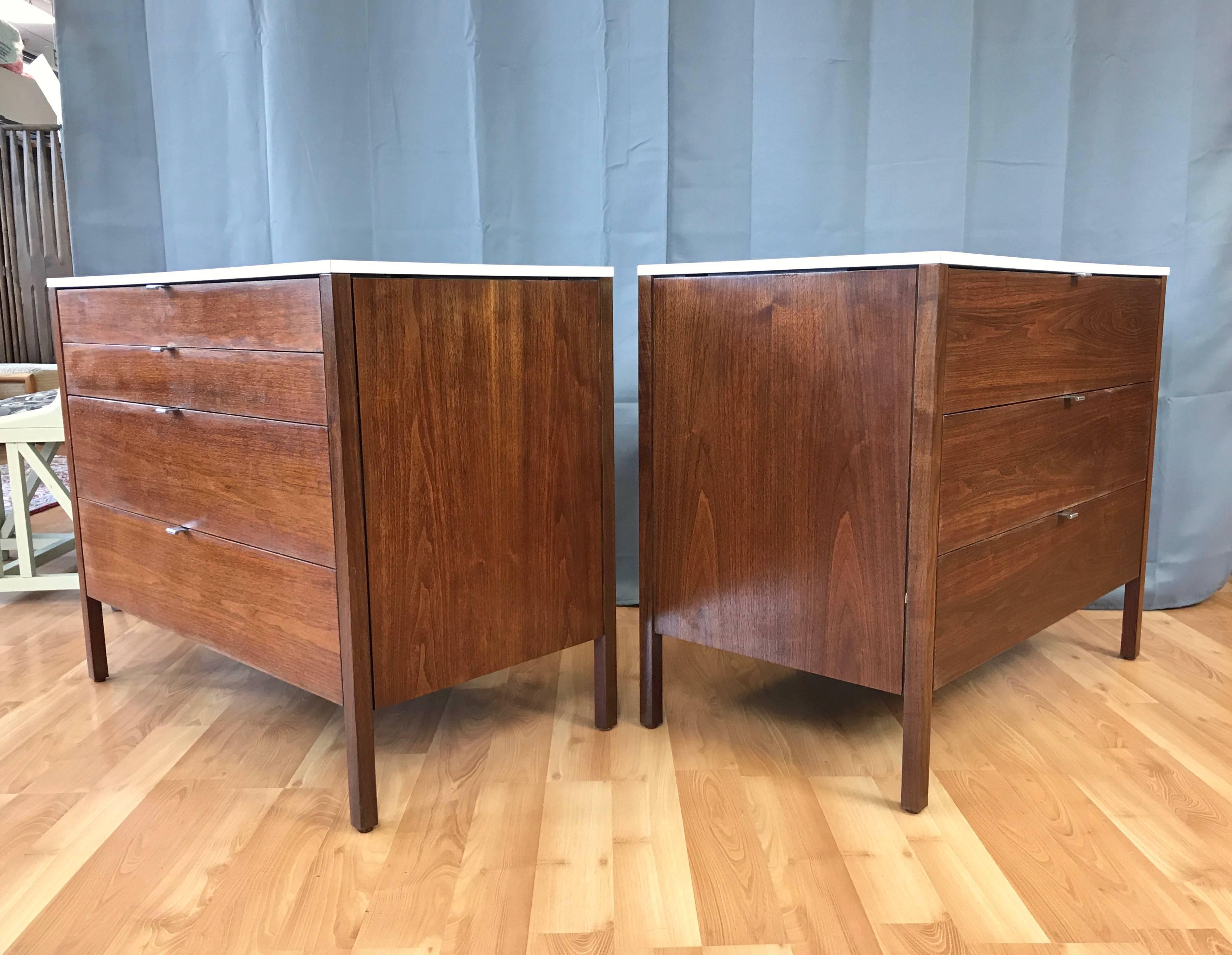 Two Mid-Century Modern walnut dressers or nightstands with white laminate tops designed by Florence Knoll for Knoll Associates in 1957.

Knoll’s signature Minimalist design aesthetic is perfectly expressed by these handsome chests, one with four