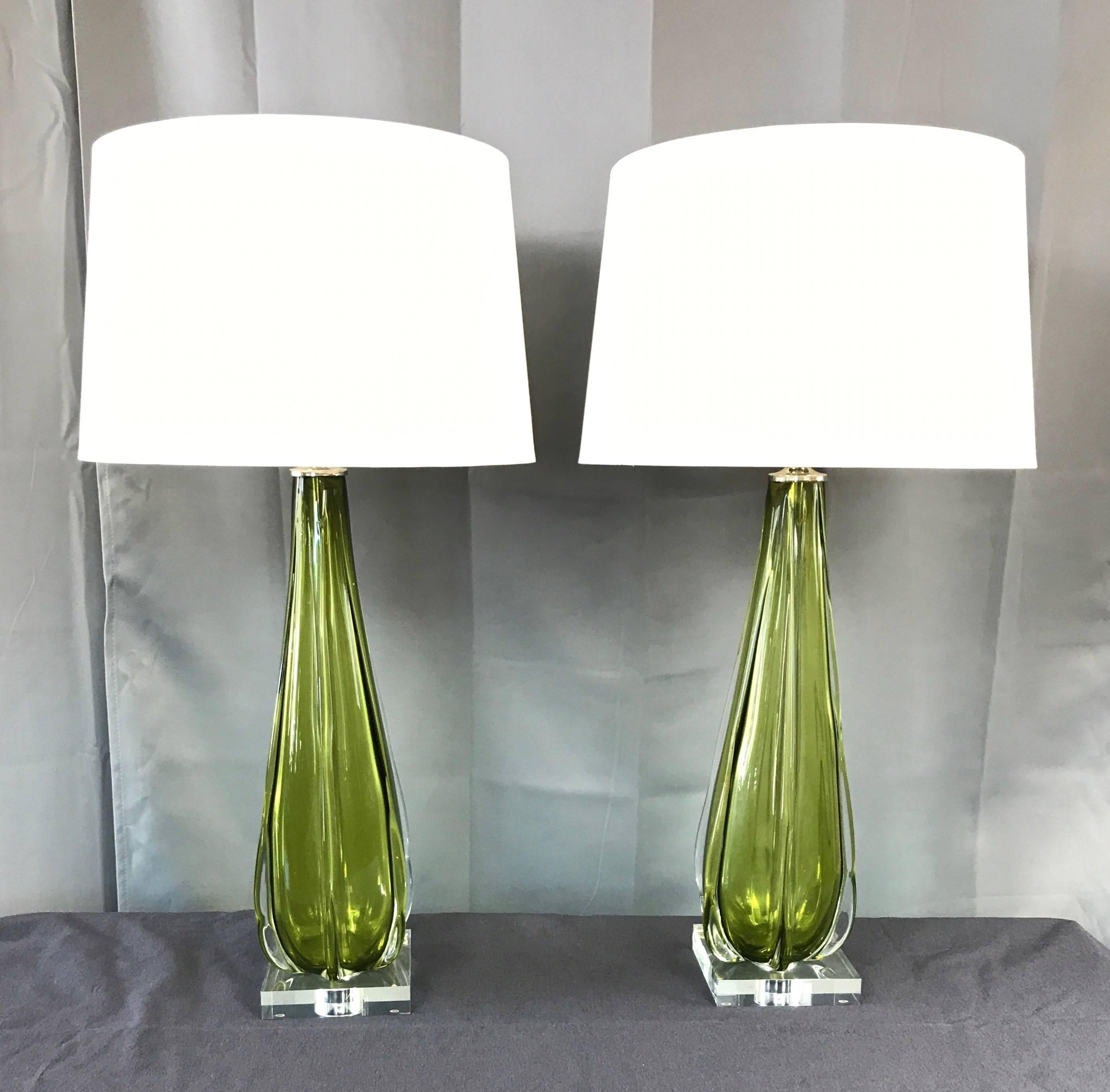 An especially elegant and tall pair of Murano glass table lamps with vintage bodies by Seguso on contemporary Lucite bases.

Absolutely beautiful handblown Sommerso form features a luminous green tourmaline-colored interior encased in sculptural