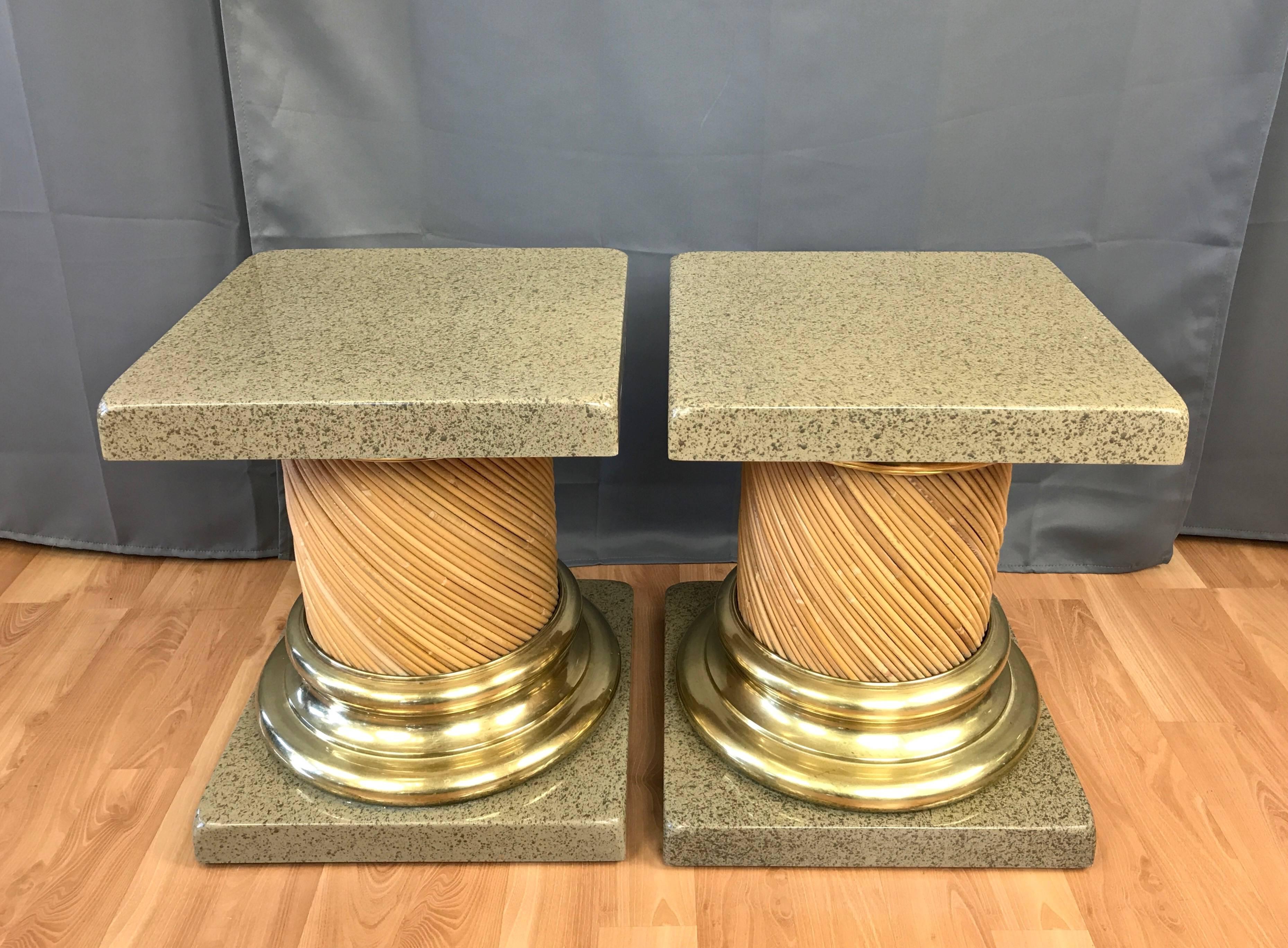 A pair of vintage Tuscan column-style end tables or pedestals with reed barrels, brass collars, and lacquered bases and tops.

Base and top are solid wood with a glossy faux-granite poured lacquer finish. Substantial collars are polished solid