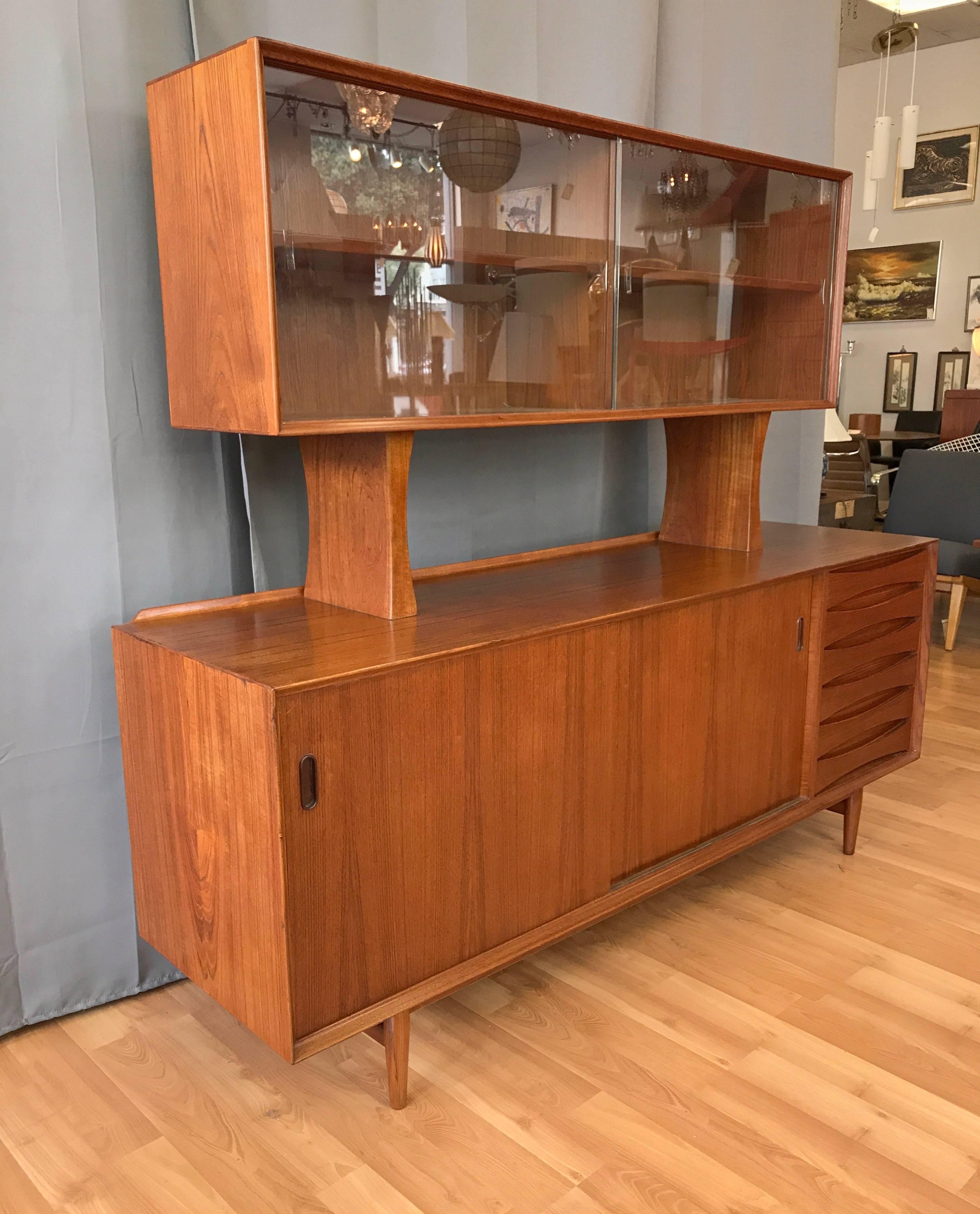A fantastic teak OS-29 teak sideboard or credenza with rare freestanding floating bookcase hutch designed by Arne Vodder and produced by Povl Dinesen. Offered as a set or as two separate pieces.

Originally produced by Sibast Møbler, the OS-29