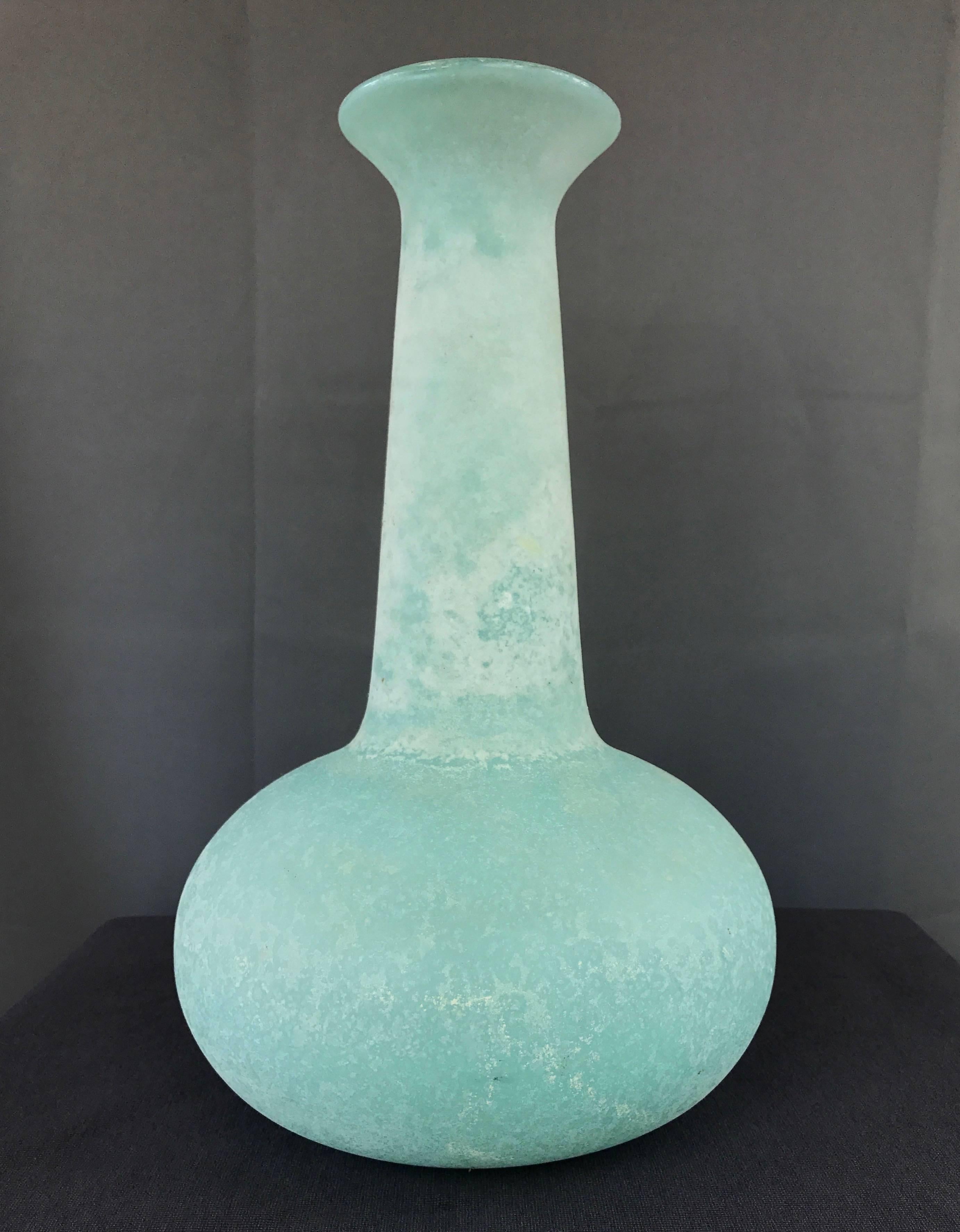 A tall scavo or corroso glass vase by Murano studio Cenedese.

Large handblown body has a bulb base and elongated neck with flared lip. Luminous powder blue color in combination with frosty white finish is evocative of glacial ice or an arctic