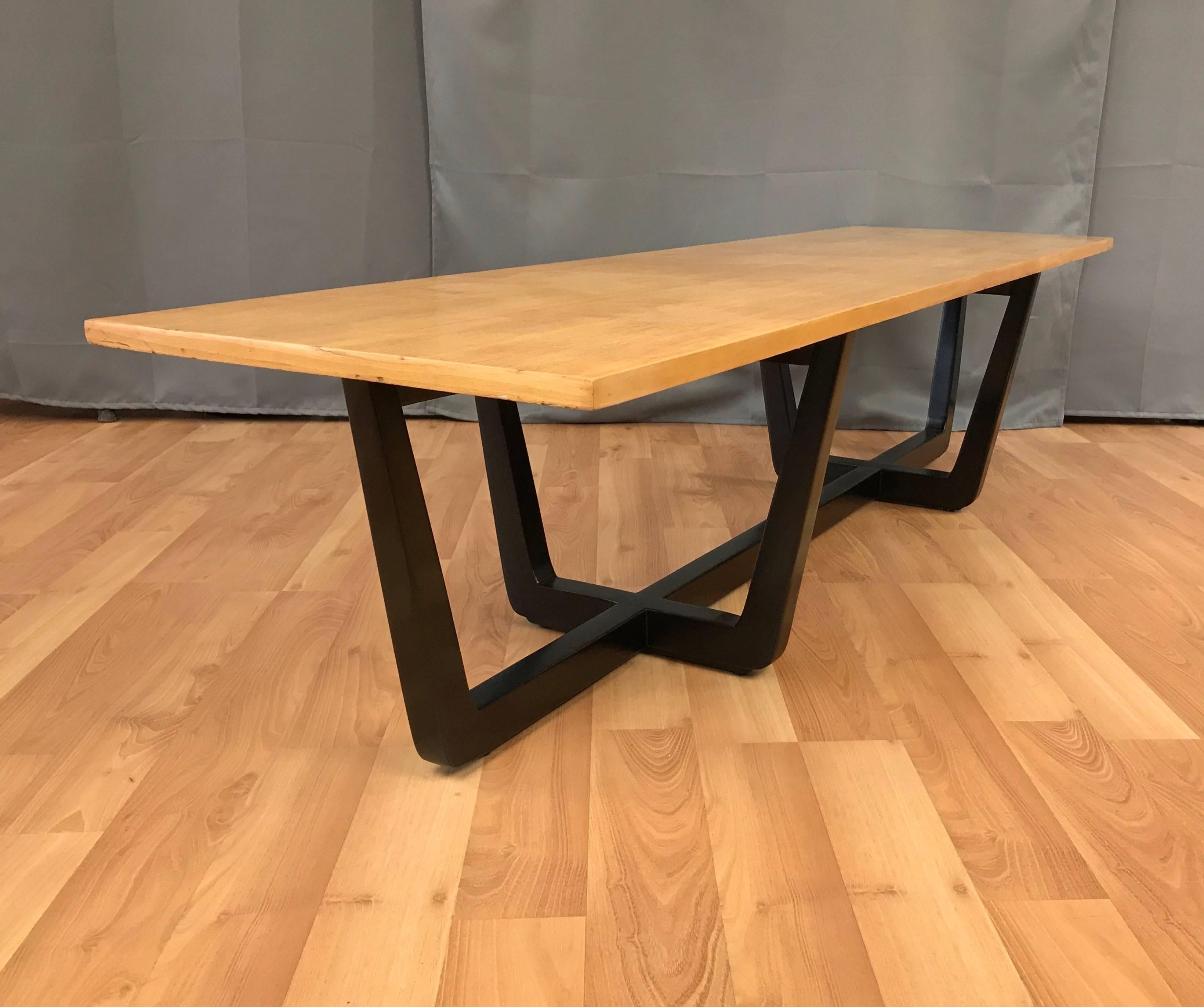 A Model No. 203 elm bench or coffee table designed by Edward Wormley for Drexel’s Precedent Collection.

Long rectangular top in linear-grain elm veneer. Satin black lacquered base comprised of three intersecting tapered U-shaped elements. Very