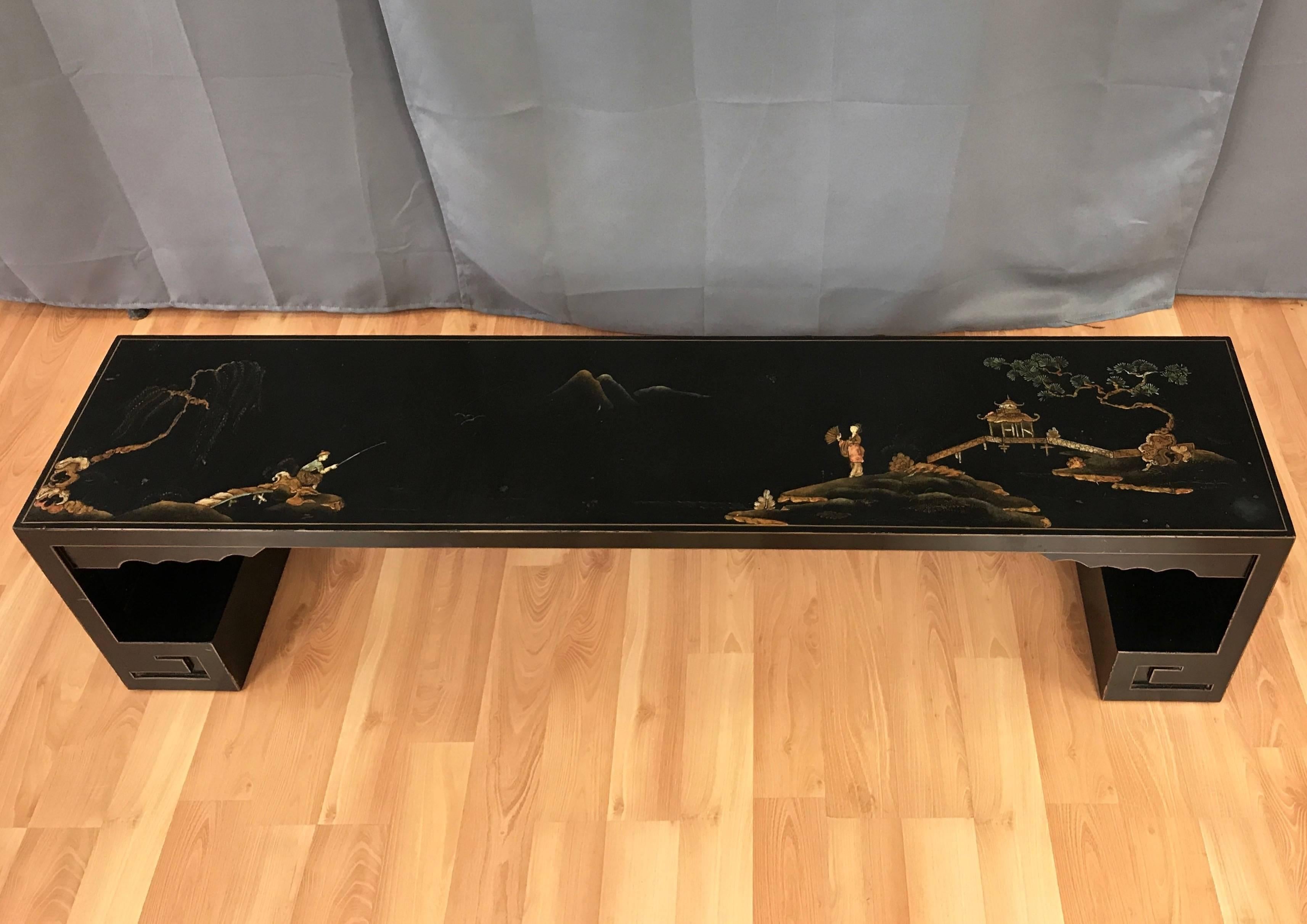 A vintage Japanese black lacquered bench with hand-painted decoration.

Long, low bench is finished in black lacquer with gold pinstriping. Grounded by robust Greek key-style feet, a design motif often seen in Meiji period pieces. Batwing-like