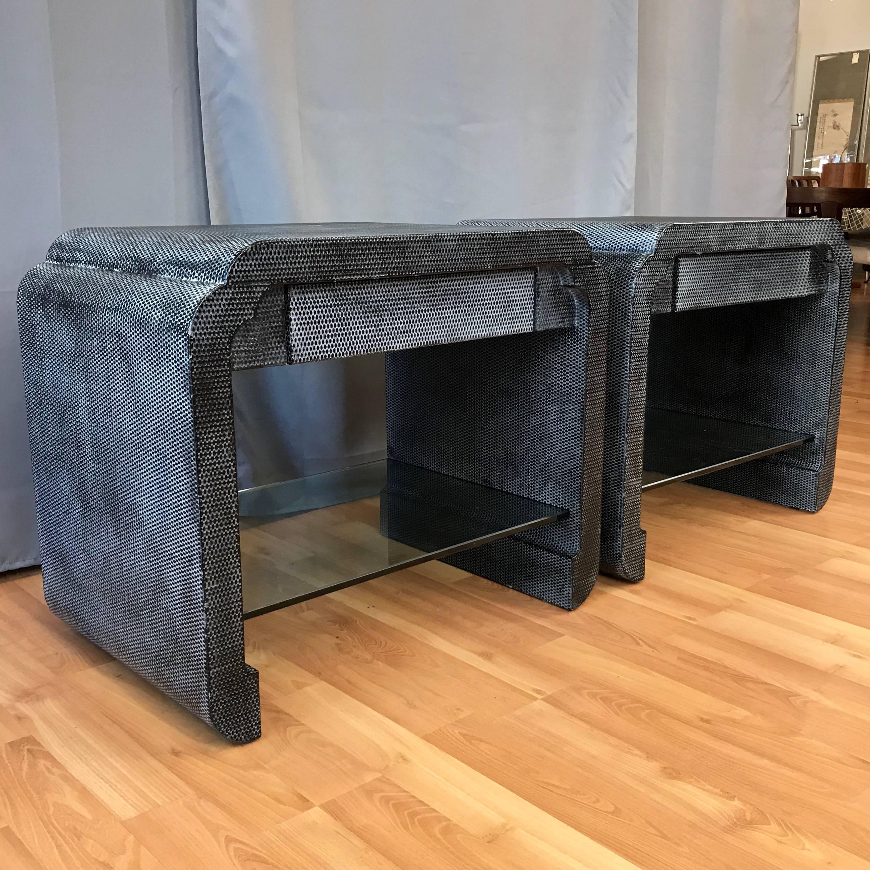 A fantastic pair of uncommon lacquered raffia-clad end tables or nightstands by Harrison-Van Horn.

Fully finished in semi-gloss black lacquered raffia with a white wash that gives them a carbon fiber-like appearance, with a shifting