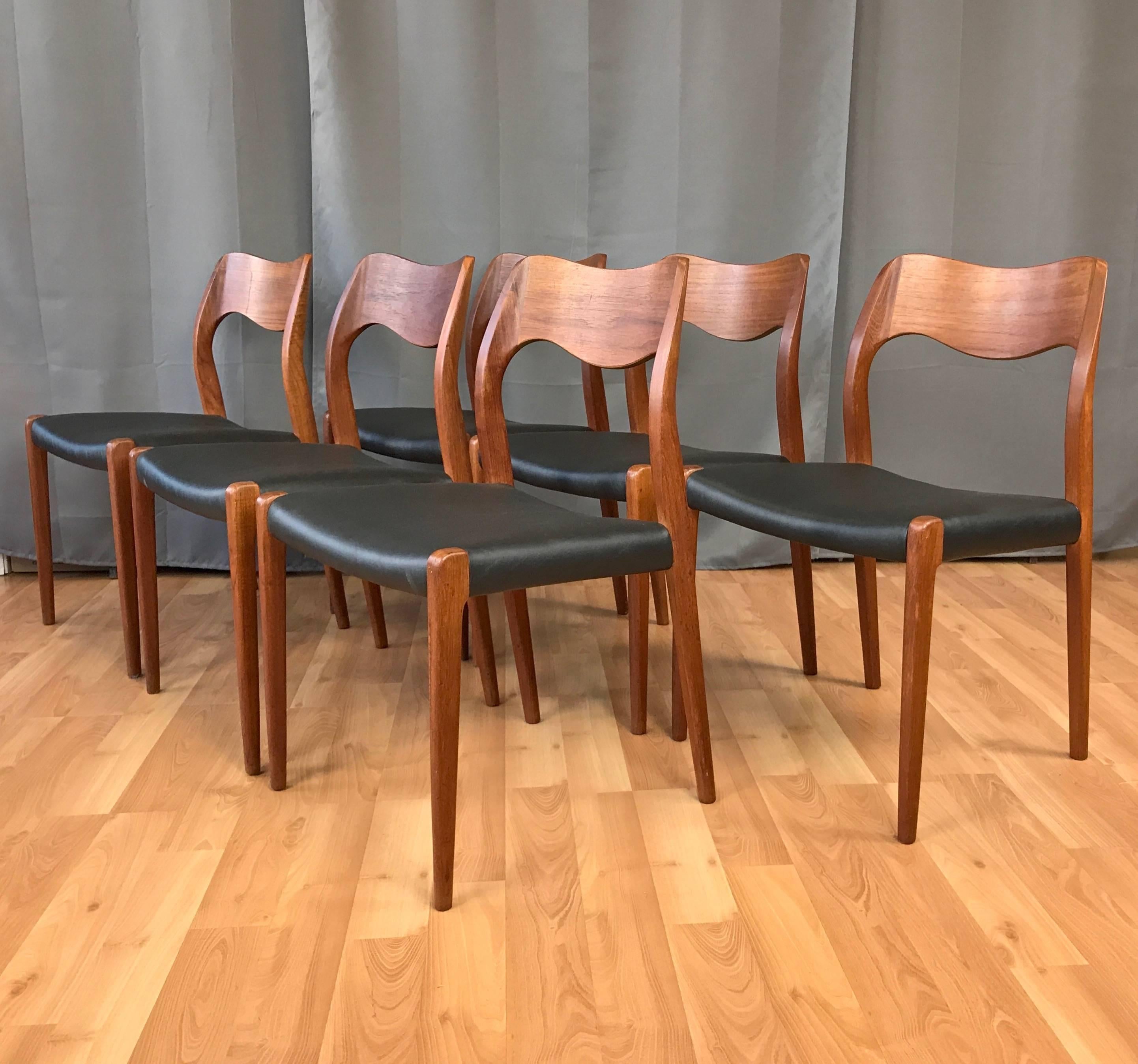 A six-piece set of teak model 71 dining chairs by Niels Otto Møller for J.L. Møllers Møbelfabrik.

A comfortable and classic Danish modern design featuring sculptural solid teak frames newly reupholstered in black faux leather.