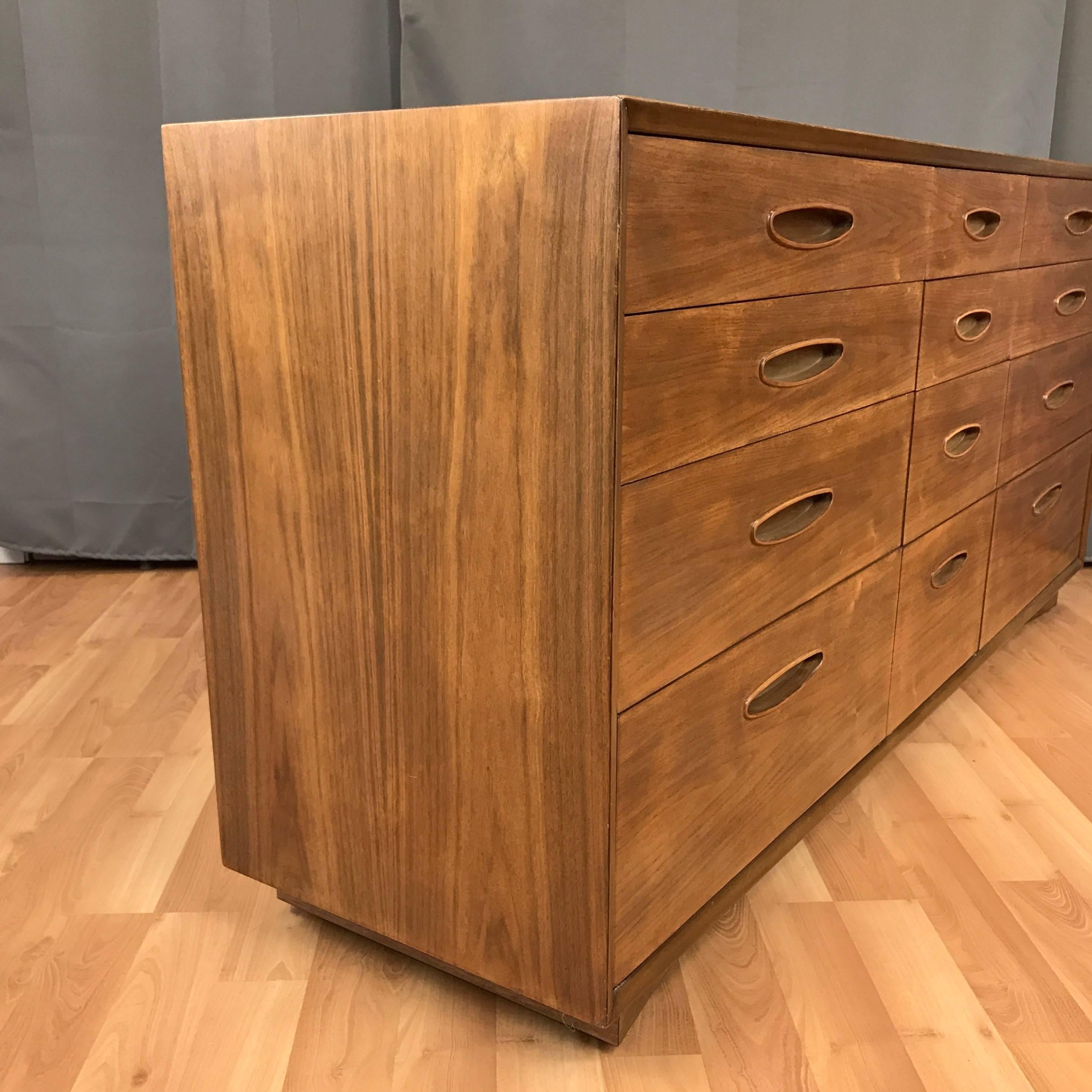A twelve-drawer walnut dresser from Henredon’s mid-century modern “Circa ’60 Collection”.

Introduced in the 1950s, Henredon’s ads from that time described their forward-looking “Circa ’60 Collection” as being “designed to blend with any period