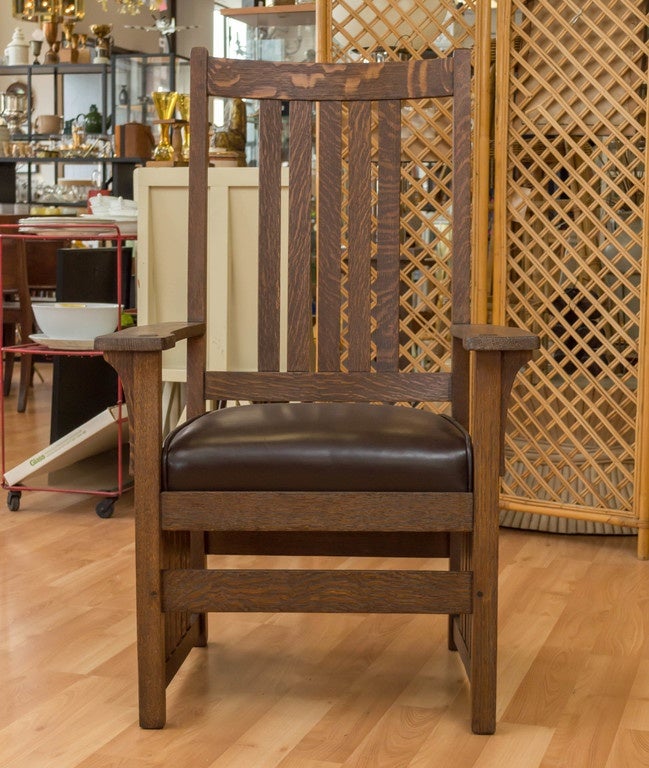 L. & J.G. Stickley armchair, refinished and the seat has been reupholstered in soft Brown leather.