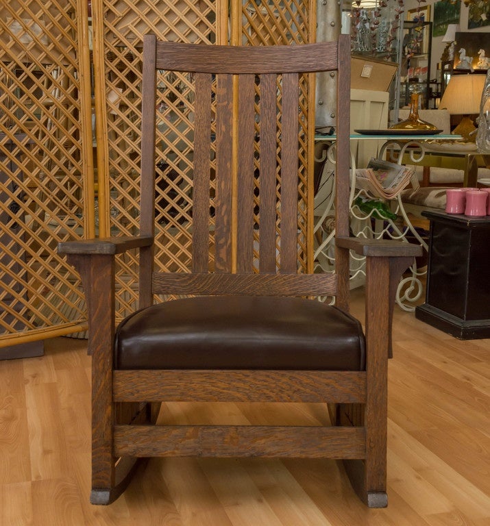 A L & JG Stickley Rocker, refinished and the seat has been reupholstered in soft Brown leather.