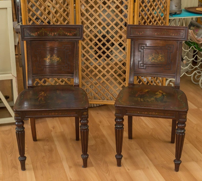 A pair of neoclassical chairs, with saber back legs, circa 1860. Hand-painted, signed F. Lefevre, French.