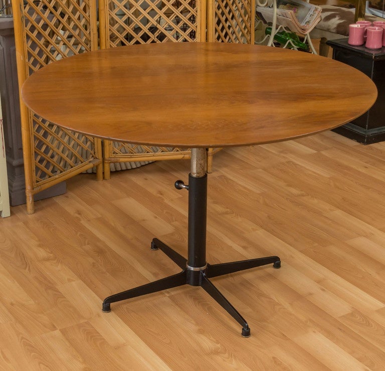 Danish Teak coffee/cocktail table, signed but we just can't make it out... Perfect if you have limited space because it's height adjustable, cocktail to dining, by using/turning the knob underneath.  Goes from 17in to 29.25 inches high.
