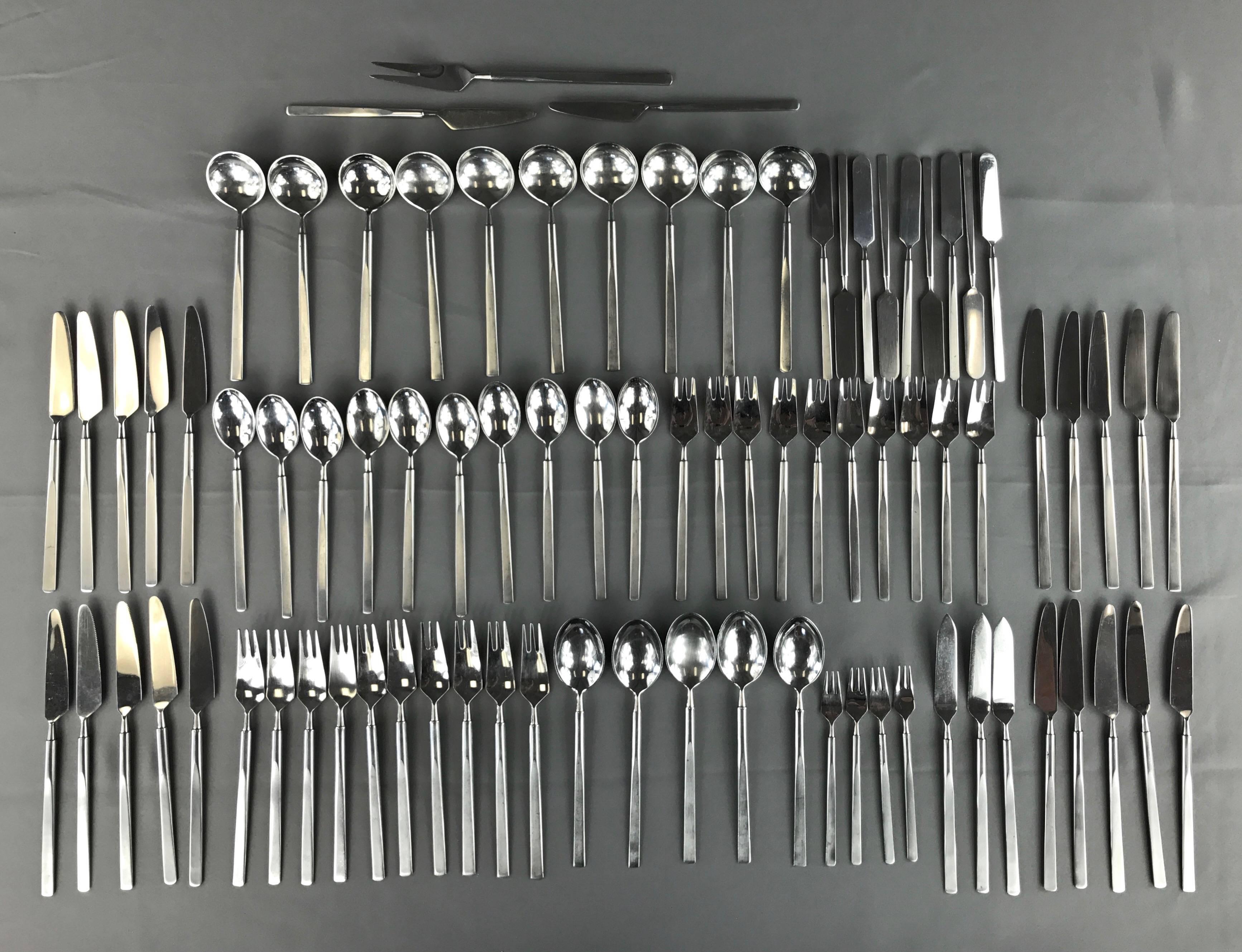 A vintage “Obelisk” 89-piece stainless steel flatware service for ten designed by Erik Herlow for Copenhagen Cutlery in 1954.

Set comprised of nine eight-piece settings, one seven-piece setting sans butter knife, and ten assorted serving pieces.
