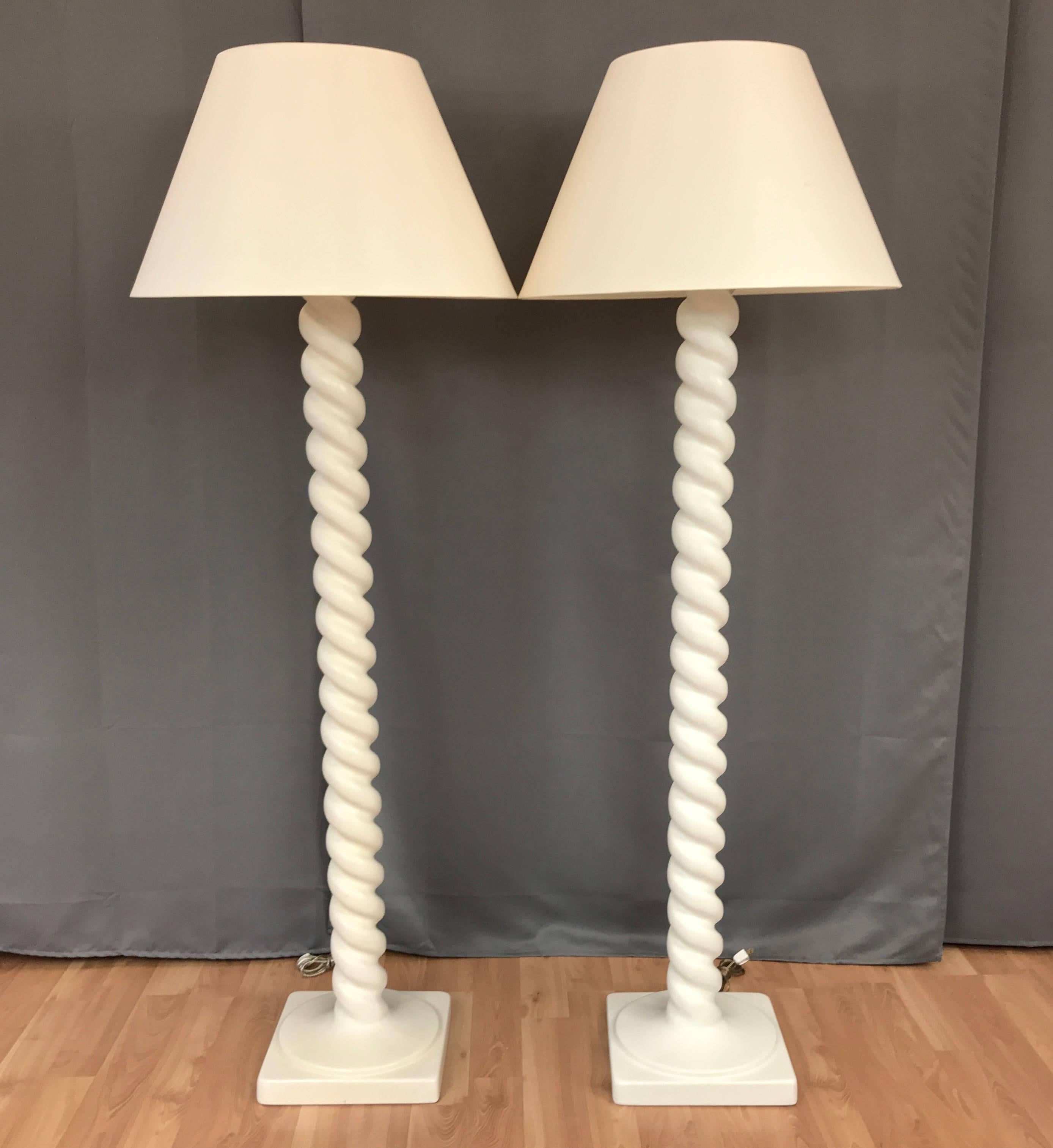 A classically chic pair of tall spiral plaster floor lamps by Michael Taylor.

Architectural and timeless, with sculptural corkscrew columns that transition smoothly to perfectly proportioned bases. Finished in satin eggshell lacquer. Recently