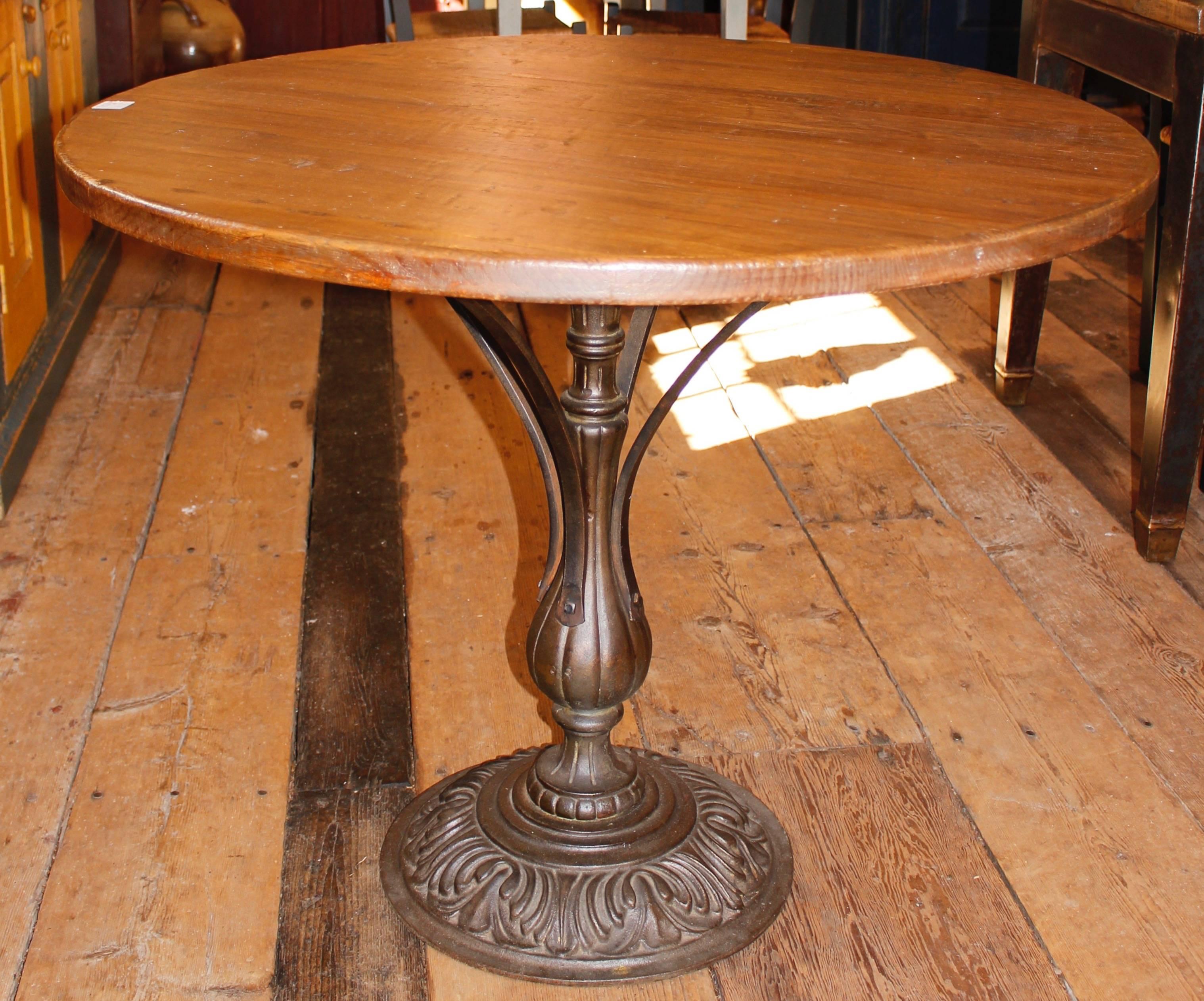 Bistro table with a decorative metal base.