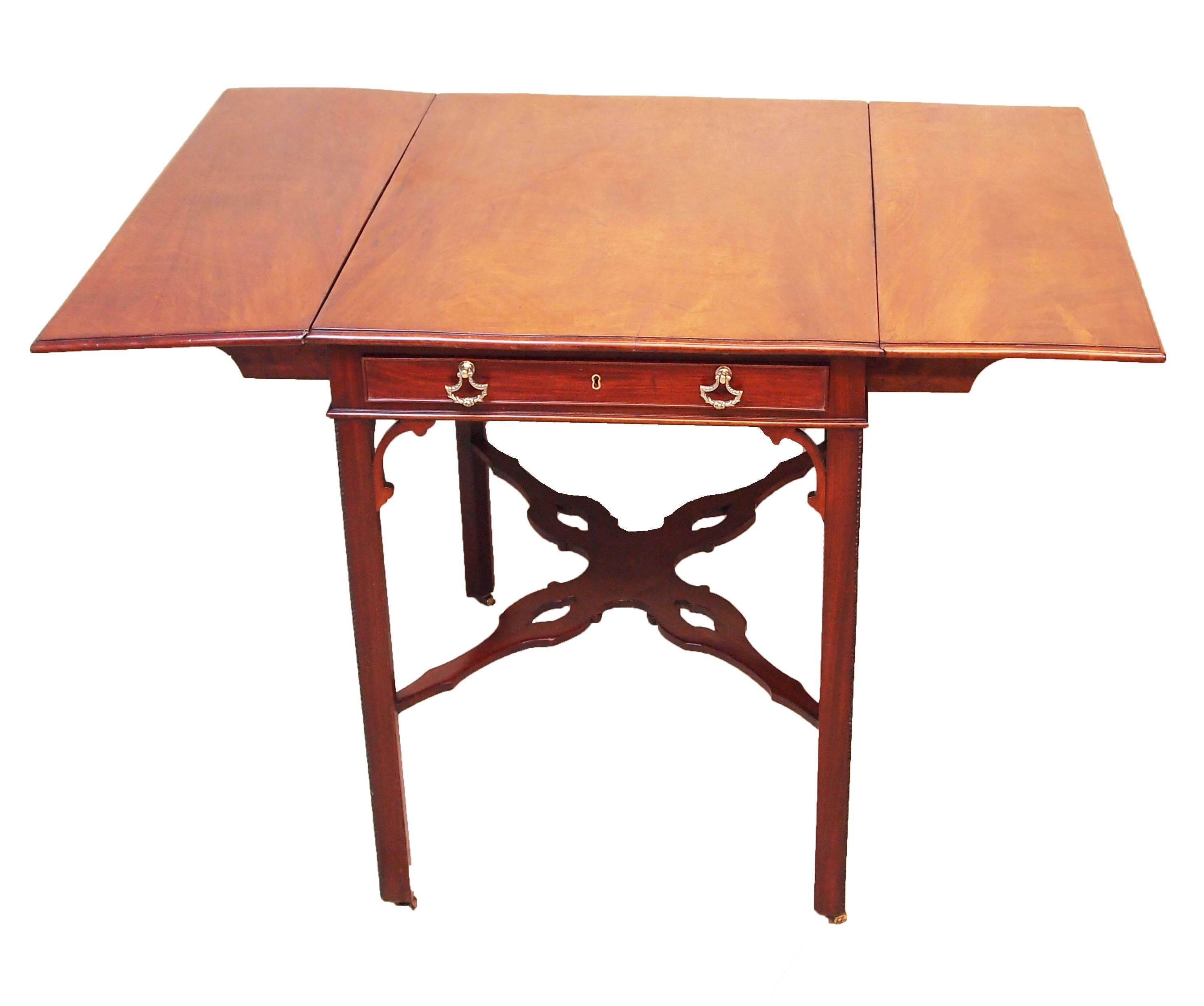 A very good quality 18th century Chippendale period mahogany supper table
having well figured two flap top above one frieze drawer raised on square
chamfered legs united by elegant pierced cross stretcher. 

H - 28in.
W - 21.5in (flaps