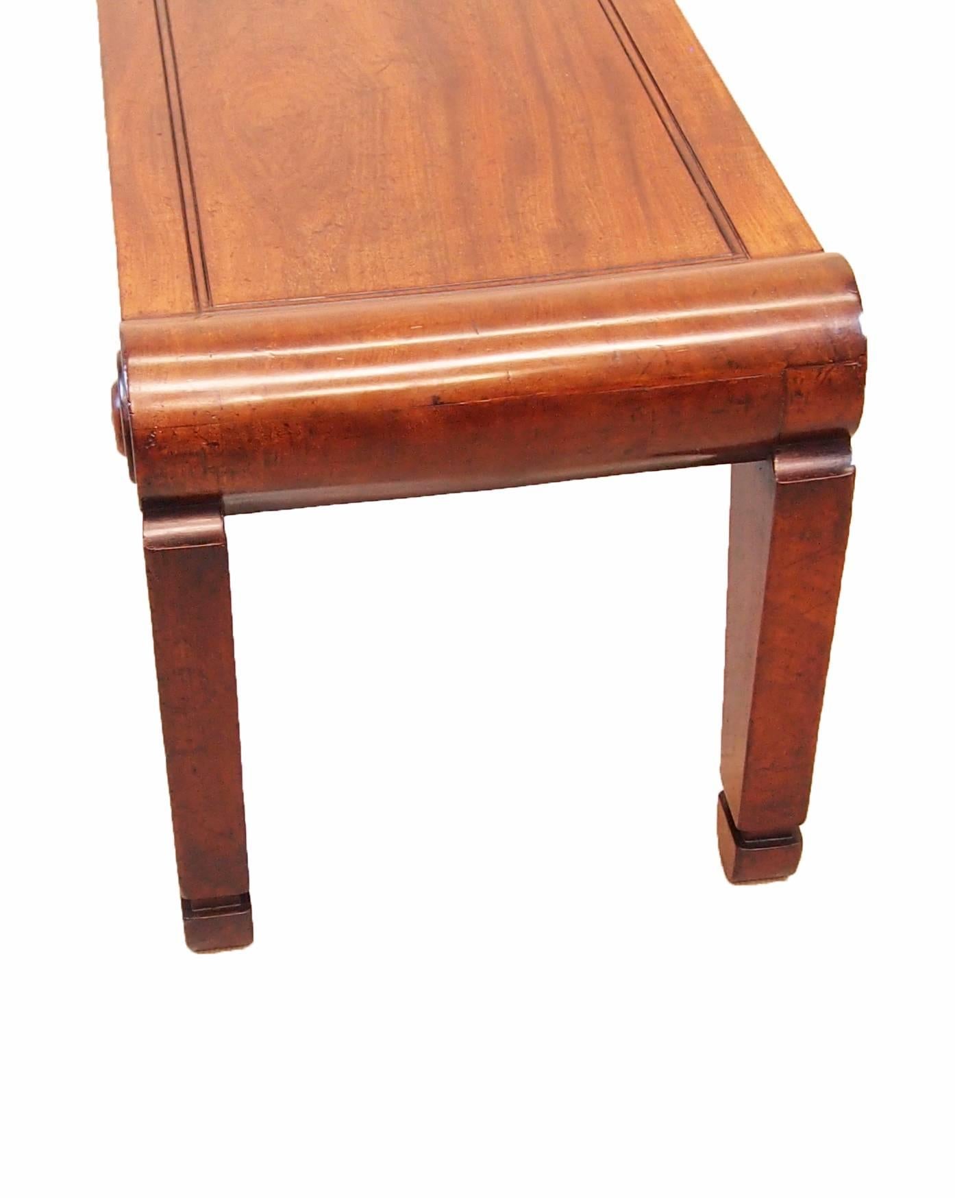 A very fine quality Regency period mahogany hall bench/seat, in the manner of Charles Heathcote 
Tatham, with superbly figured panelled seat and scrolling ends raised on elegant tapered legs
Mounted with applied roundels.
