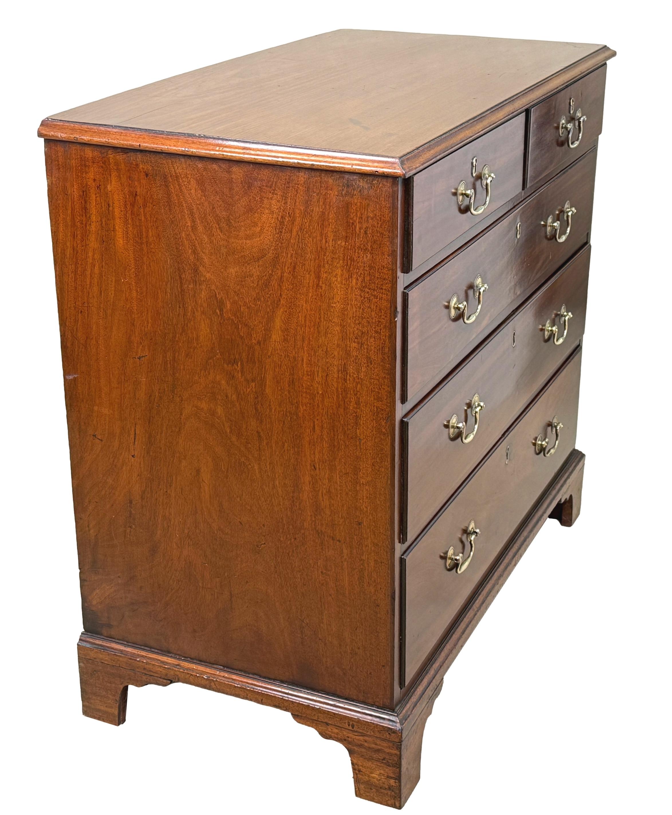 A Very Good Quality George III Period, 18th Century, Mahogany Chest, Retaining Rich Colour Throughout, With Exceptionally Well Figured Top Over Two Short And Three Long Drawers, Retaining Original Brass Swan Neck Handles, Raised On Original Shaped
