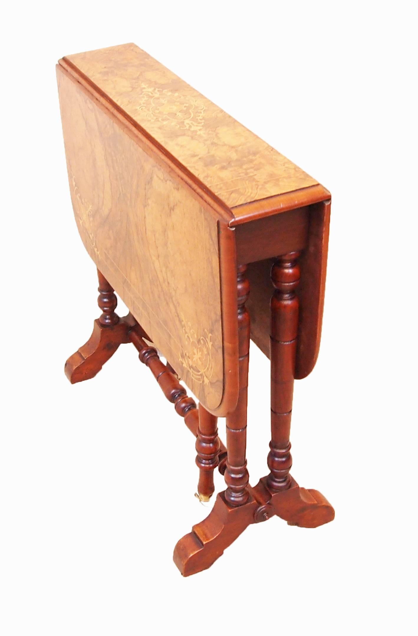 A very attractive late 19th century walnut baby Sutherland table
Having superbly figured and inlaid two flap top raised on
Elegant turned upright supports.