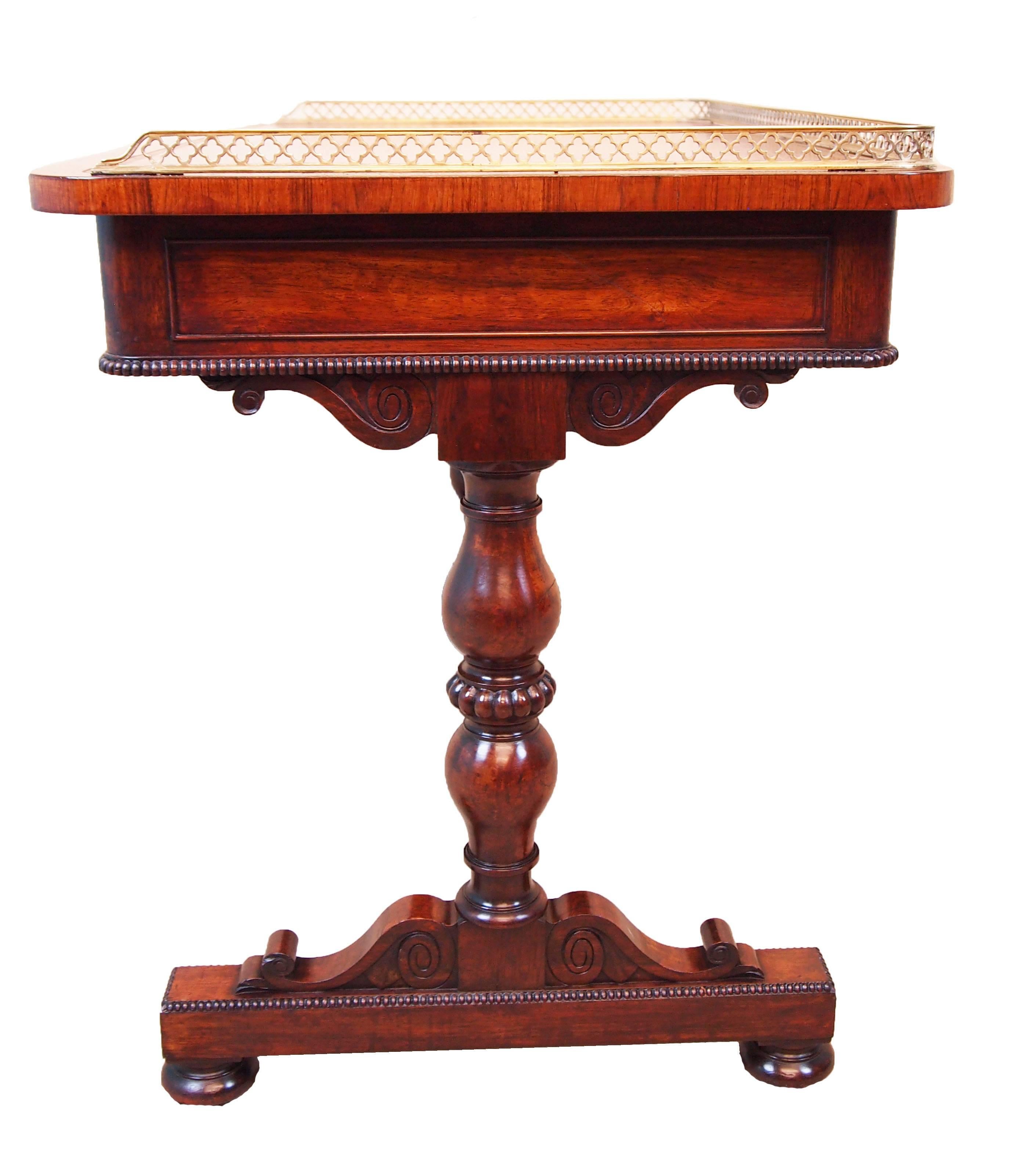 A fine quality Regency period rosewood library writing table having original
Brass gallery to leather inset and crossbanded top above two frieze drawers to
Front opposed by two false drawers to reverse retaining original turned
Wooden knobs