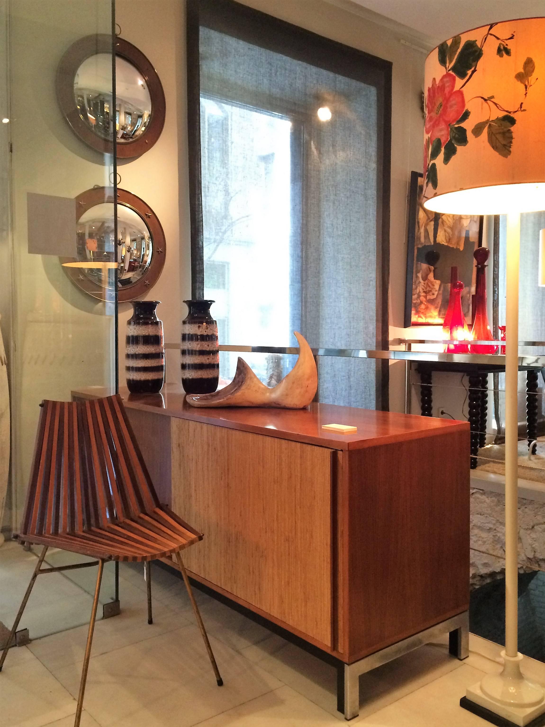 A set of four beech and walnut chairs with gilded metal feet.
  