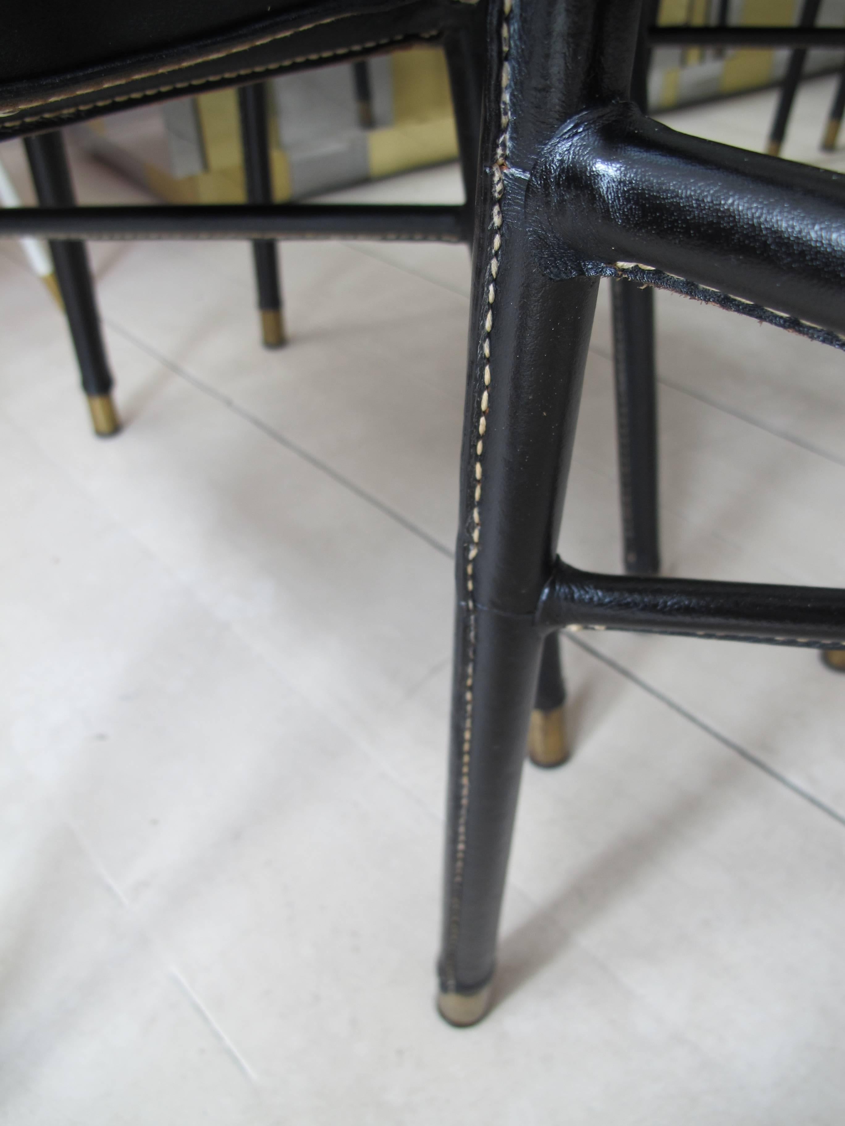Set of Seven Stitched Leather Dining Chairs by Jacques Adnet  In Good Condition In London, GB