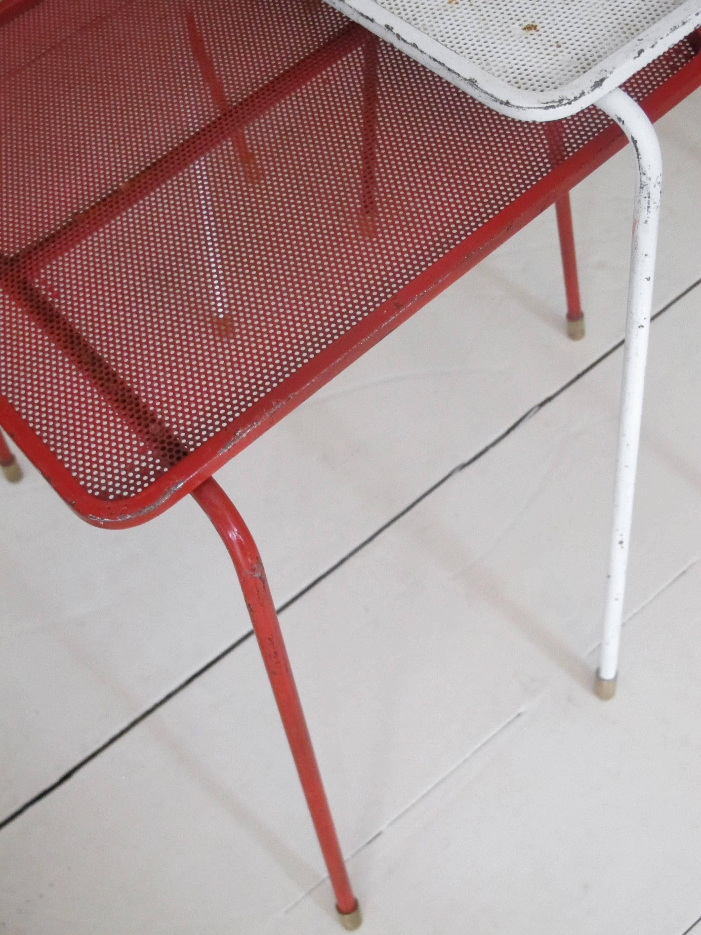 Pair of ‘Soumba’ nesting tables in red white and black perforated metal.
Painted tripod legs and brass feet,
Mathieu Matégot,
1953,
France.

Measures: 37 x 28 x 32 cm.
41 x 28 x 32 cm.
46 x 28 x 32 cm.