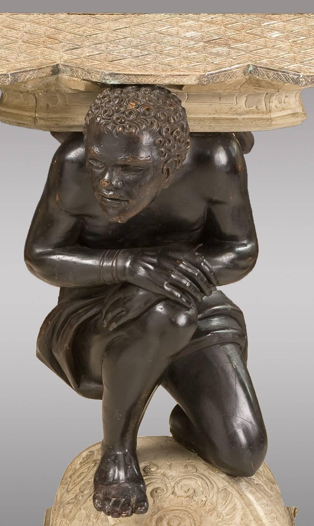 Console with a carved figure of Blackamoor and topped with silvered copper