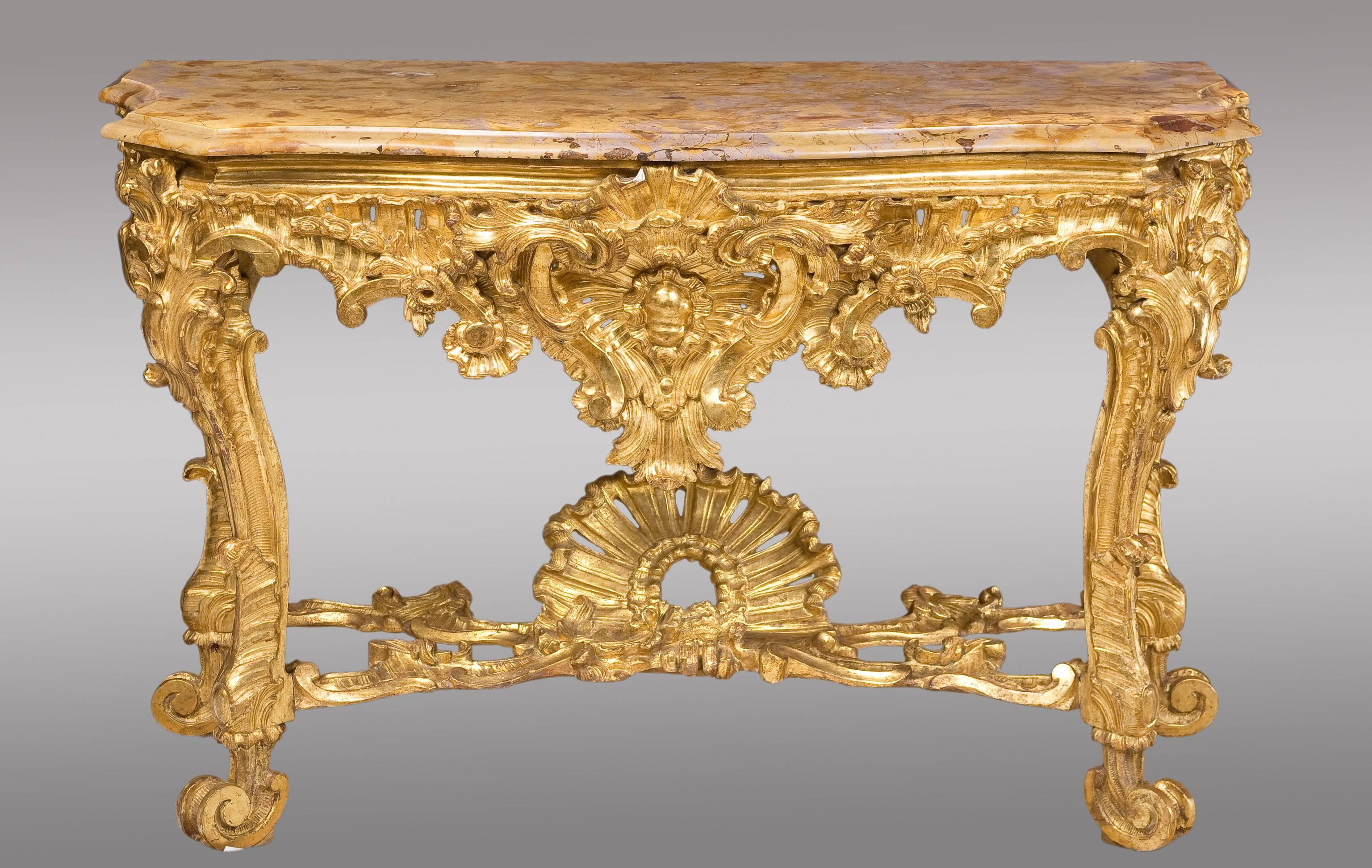 Pair of Roman consoles, 18th century.
Impressive pair in gilded wood in Baroque style.
Topped with original marble "Brocatello di Siena."

 