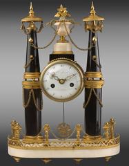 Gilt Bronze Marble Clock and Candlesticks. Louis XVI Period