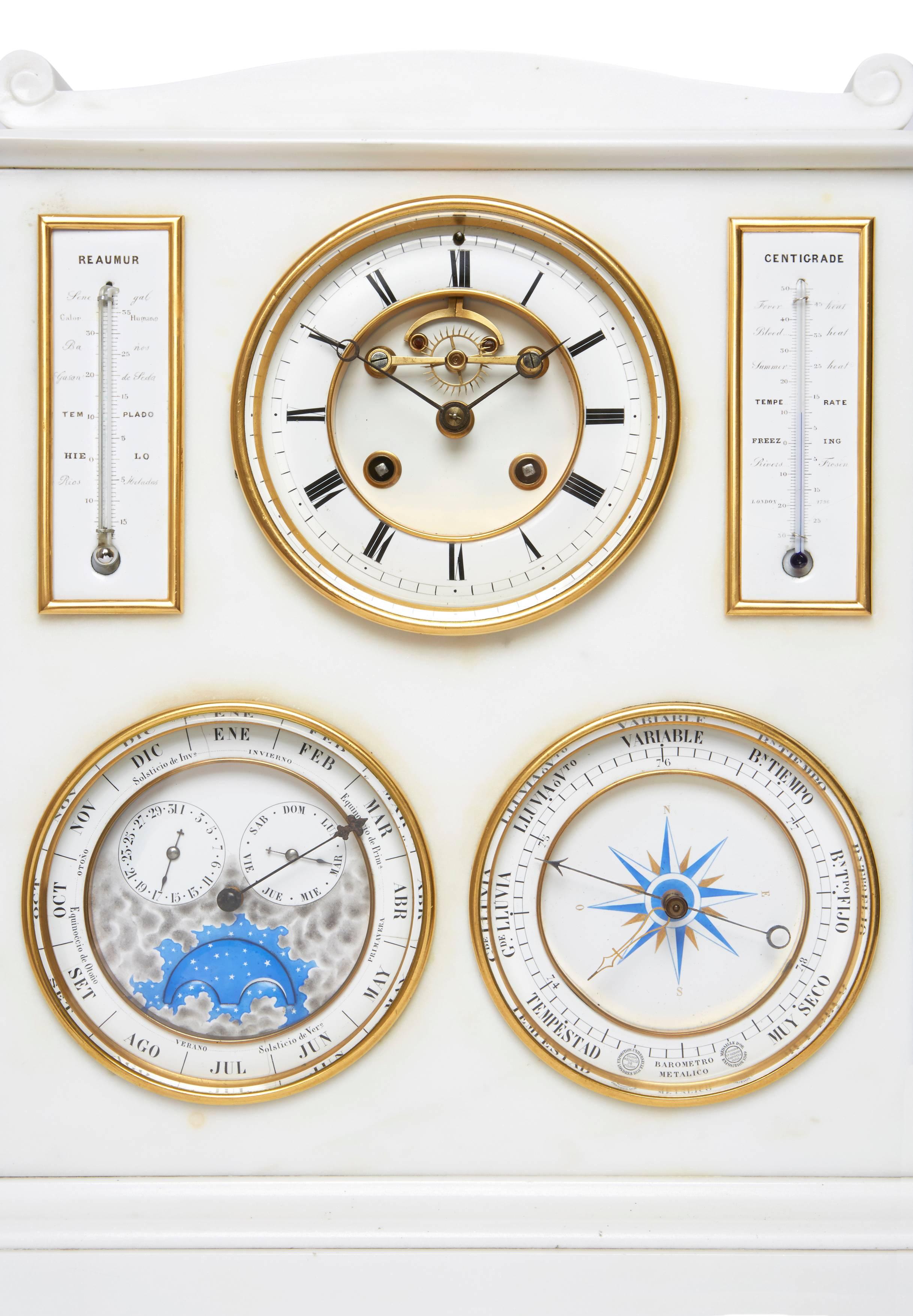 Made for the Spanish market and constructed in white Carrara marble, the front with three circular dials for the clock, barometer and lunar scale and two rectangular thermometers. 

This fascinating object would make a unique gift, combining elegant