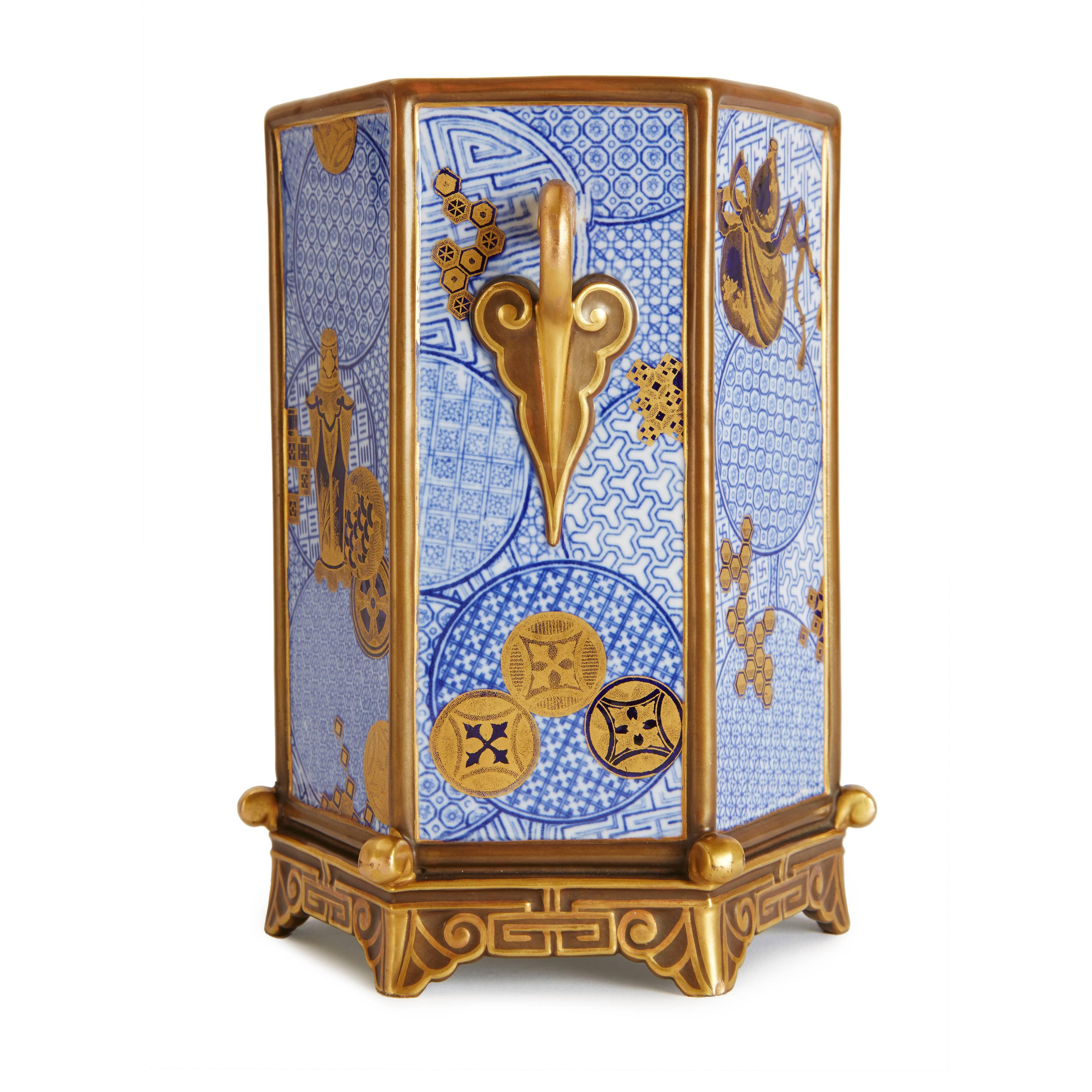 Each with twin gilt handles, with blue geometric designs and gilt highlights and decorations on a white ground, marked to undersides.