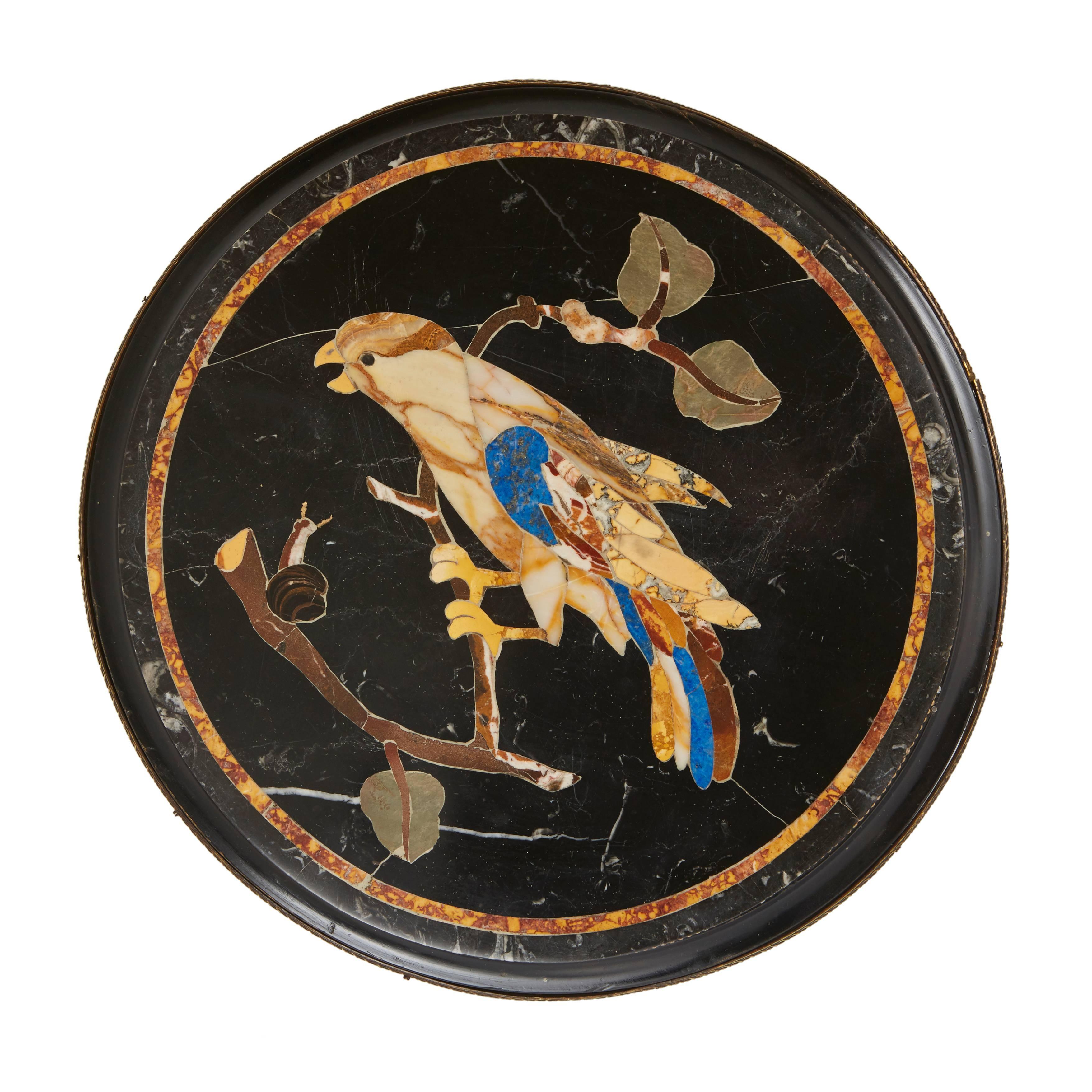 This fine pair of 19th century occasional tables exhibit an exceptional example of the marble Pietra Dura technique. Developed in 16th century Florence, this highly skilled form of inlay uses pieces of cut marble, which are placed seamlessly