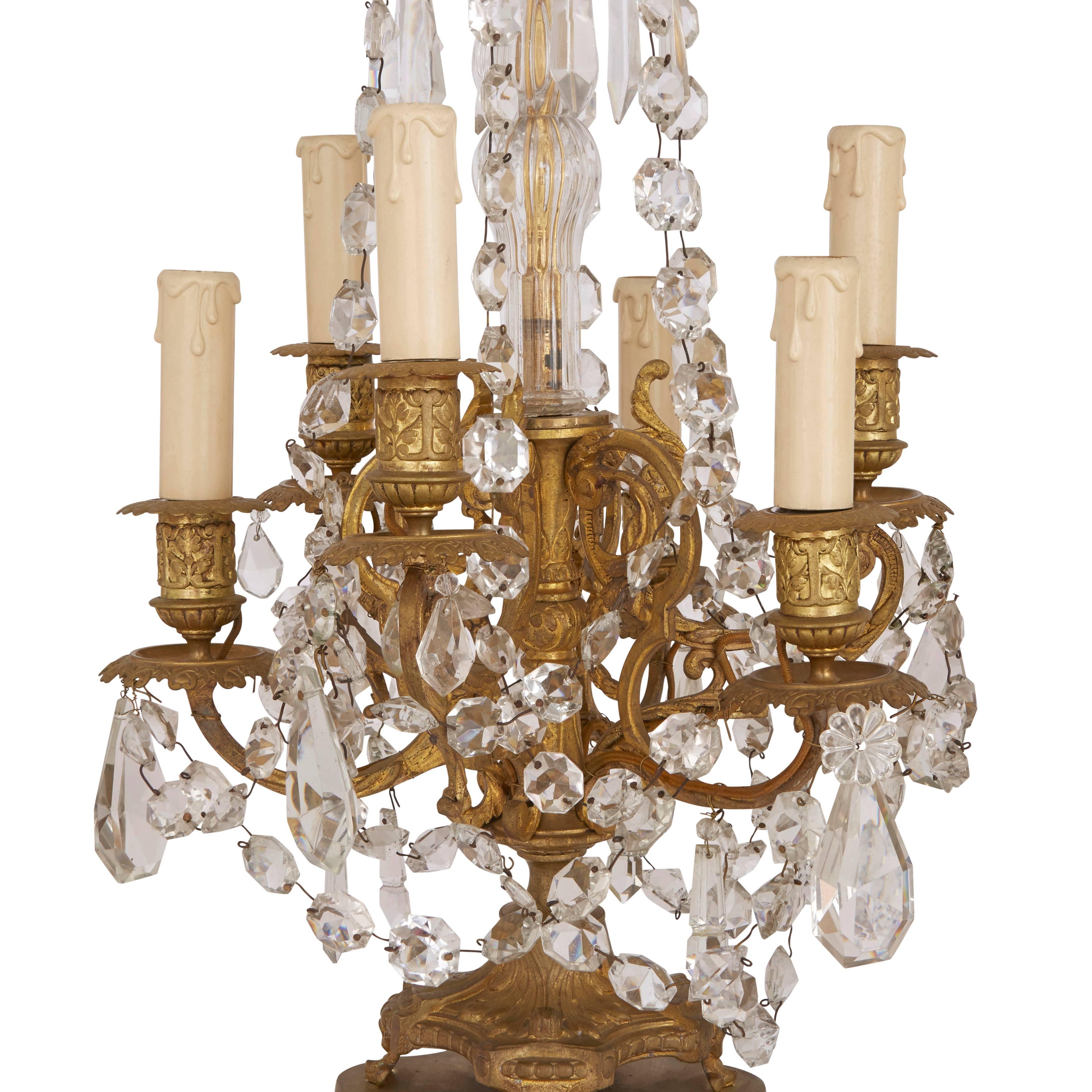 Six-light candelabra, ormolu with a glass spike surmount and two rows of hanging glass daggers and beads, one above and one below the six candles.