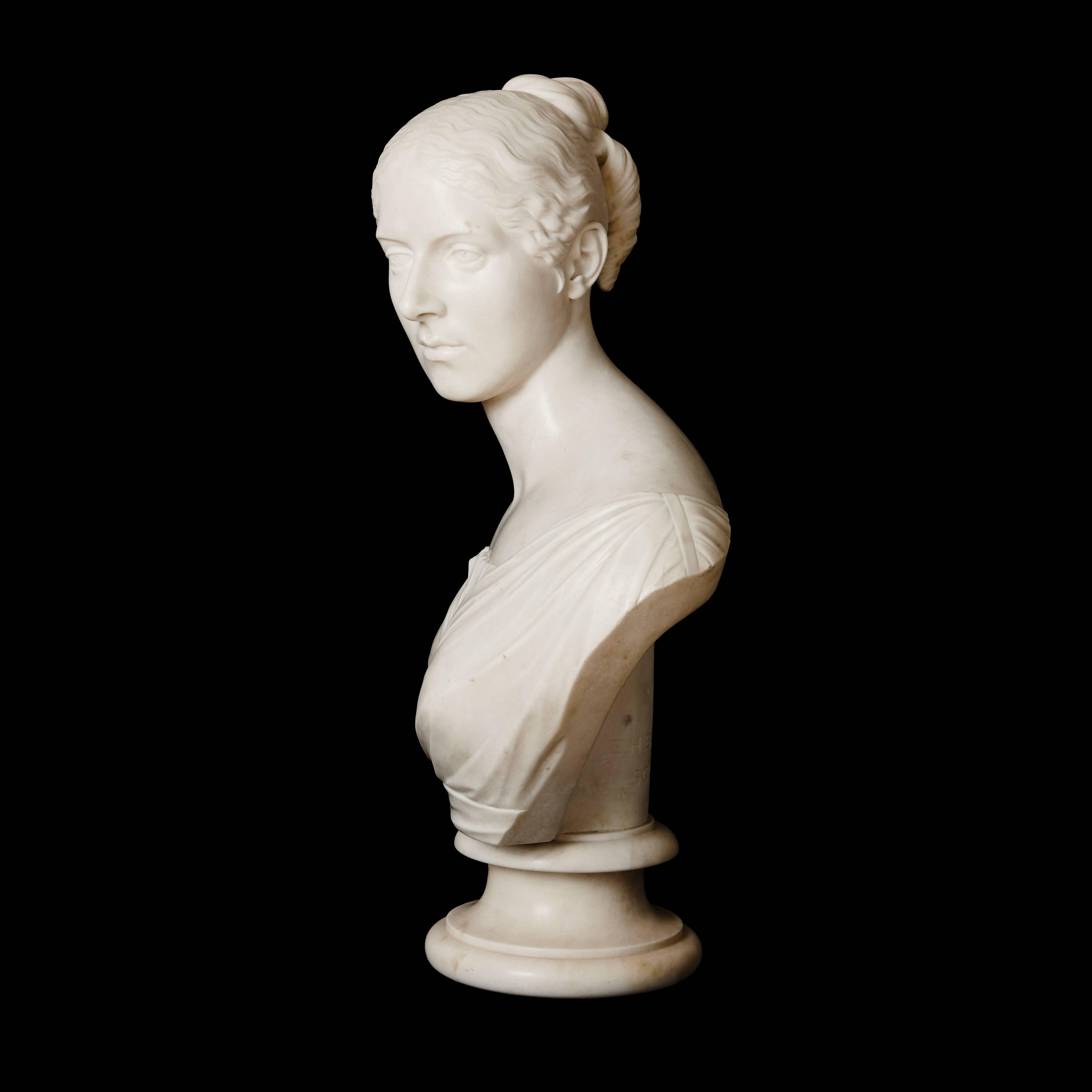 Signed and dated 'E. H. BAILY. R.A. / SCULP. 1845.' on a circular socle.

This beautiful antique bust is a brilliant example of Baily's high quality sculpture, which remains famous for its elegance and refined naturalism.