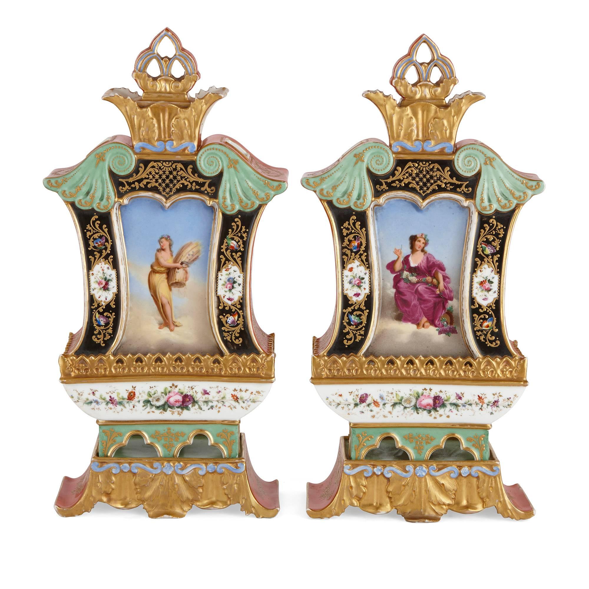 Each vase decorated on both sides with floral decorations and depictions of muses emblematic of the four seasons, both vases set on rectangular bases.

These fine 19th century French vases are distinctive for their beautiful depictions of the